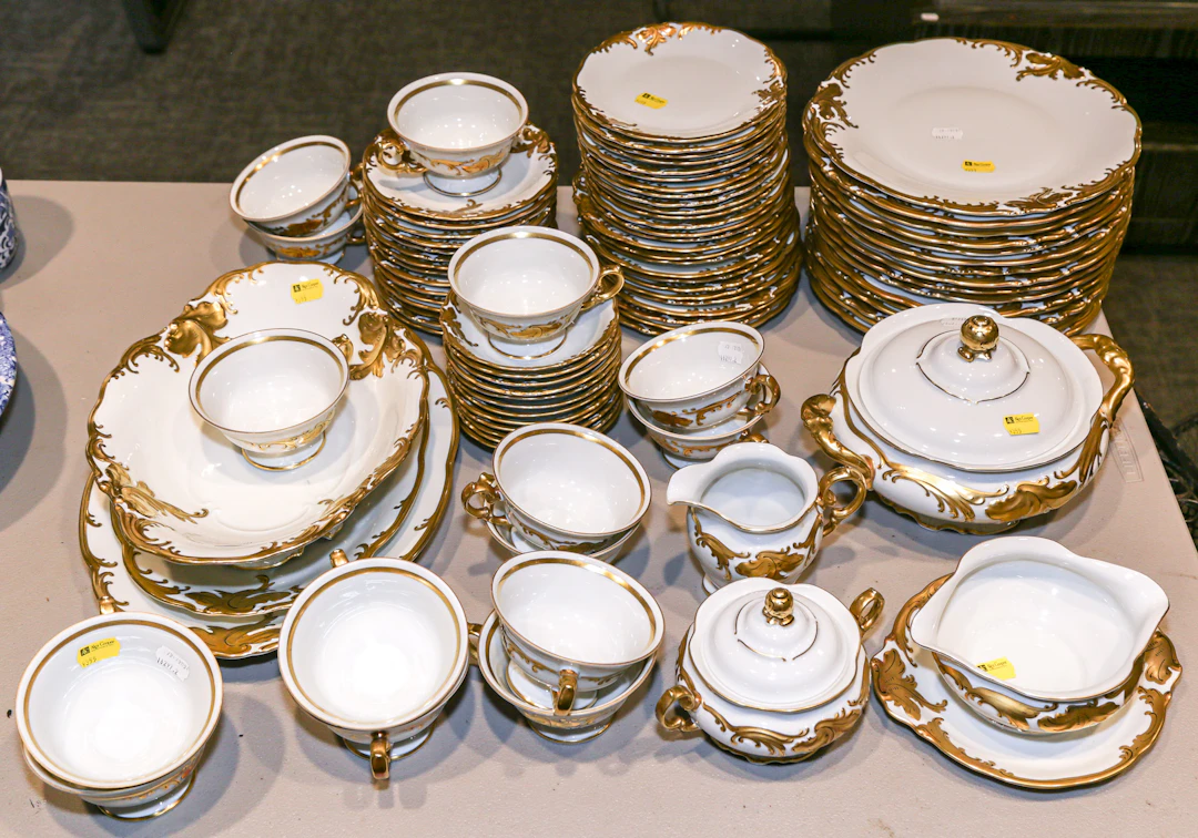 A Wawel Molded & Gilt Partial Dinner Service