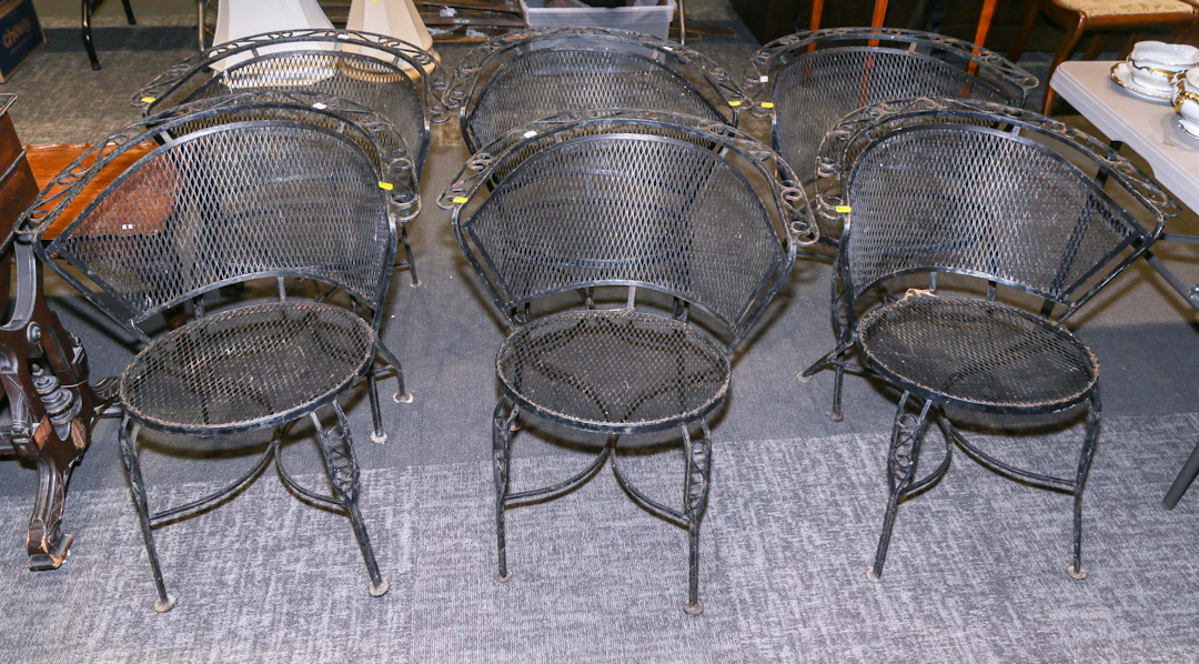 Six Wrought Iron Patio Armchairs