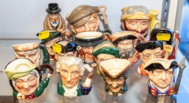 An Assortment of Royal Doulton Character Jugs