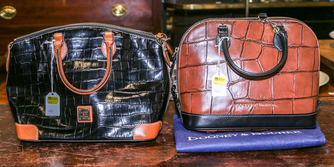 Two Embossed Dooney & Bourke Satchels