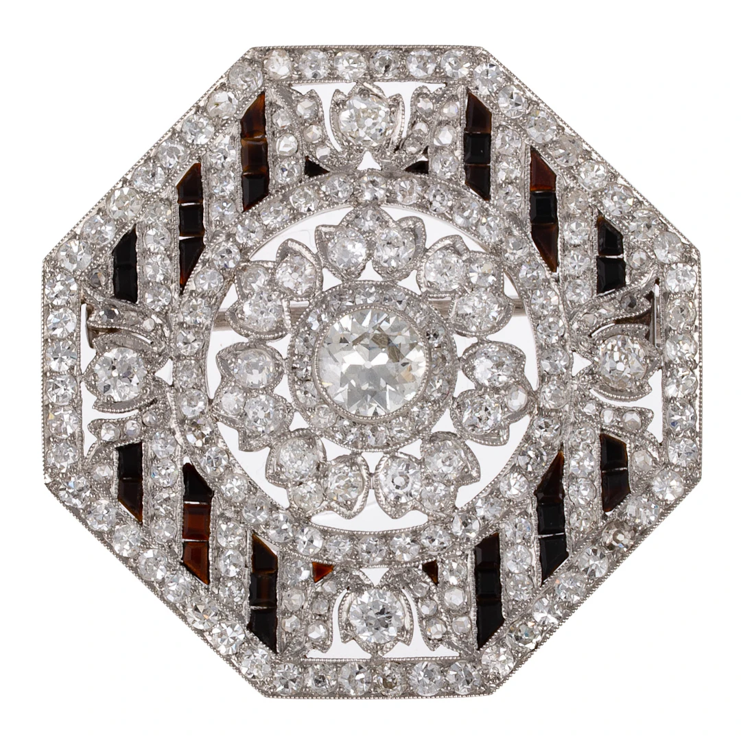A French Art Deco Octagonal Diamond & Onyx Brooch in Platinum