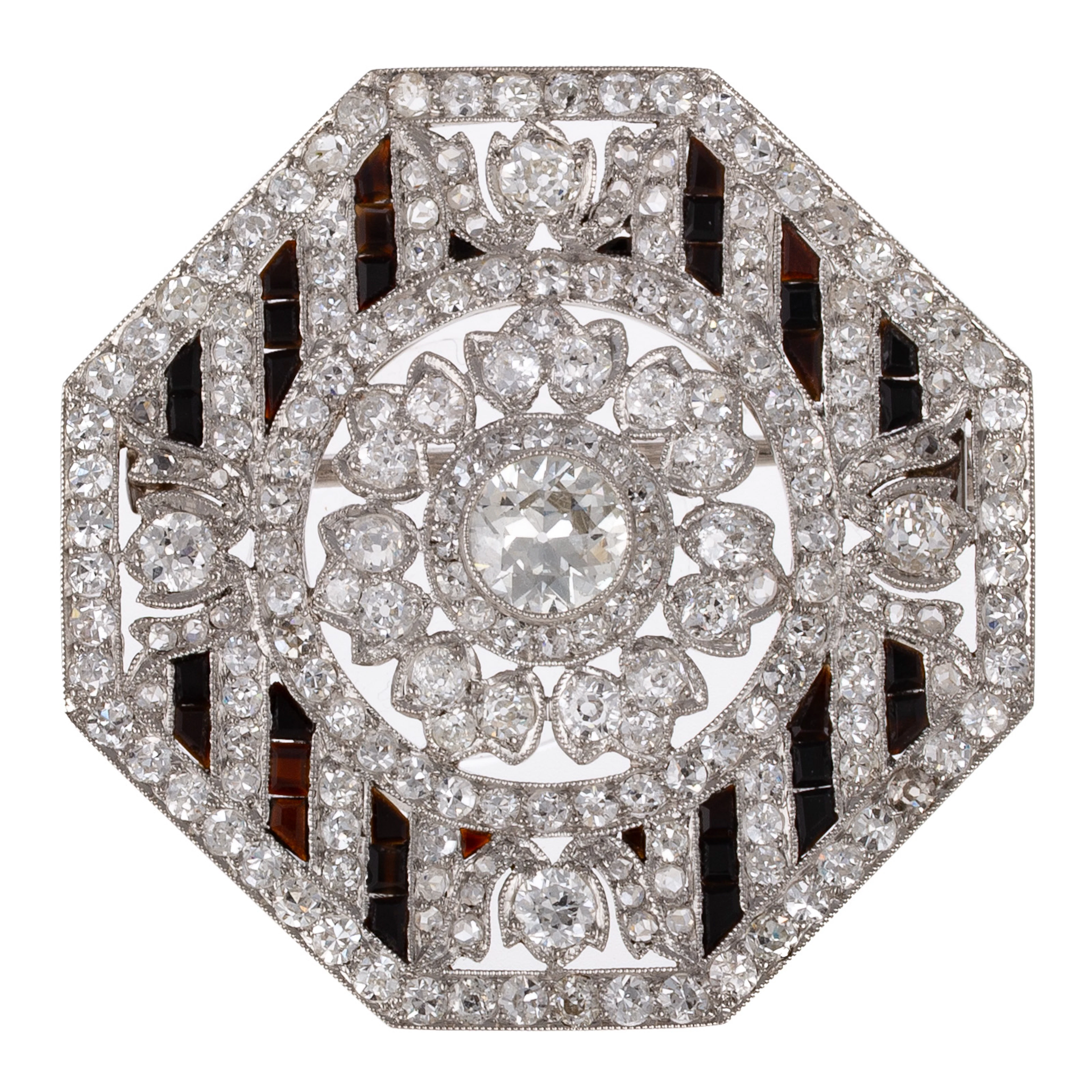 A French Art Deco Octagonal Diamond & Onyx Brooch in Platinum