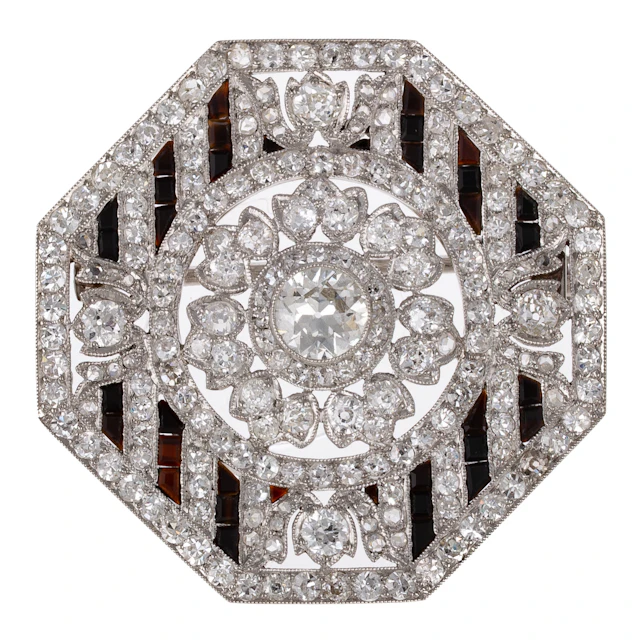 A French Art Deco Octagonal Diamond & Onyx Brooch in Platinum