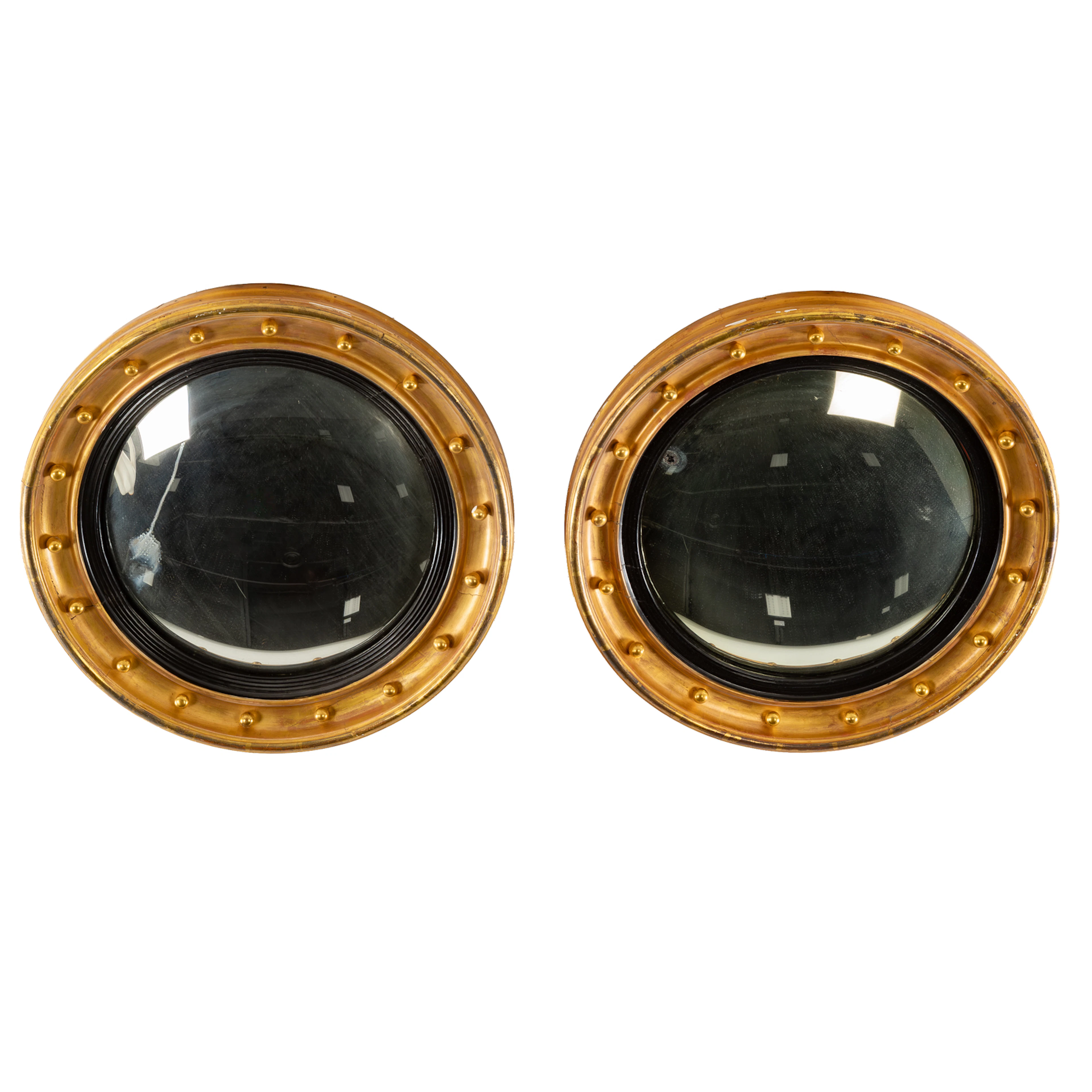 A Pair of Gilt Wood Convex Butler's Mirrors