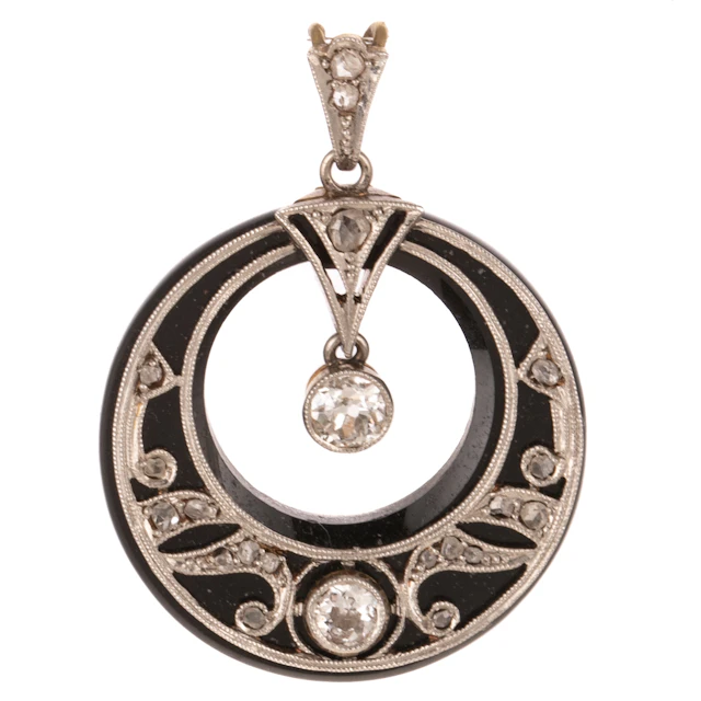 An Art Deco Diamond & Onyx Pendant in Platinum & 14K