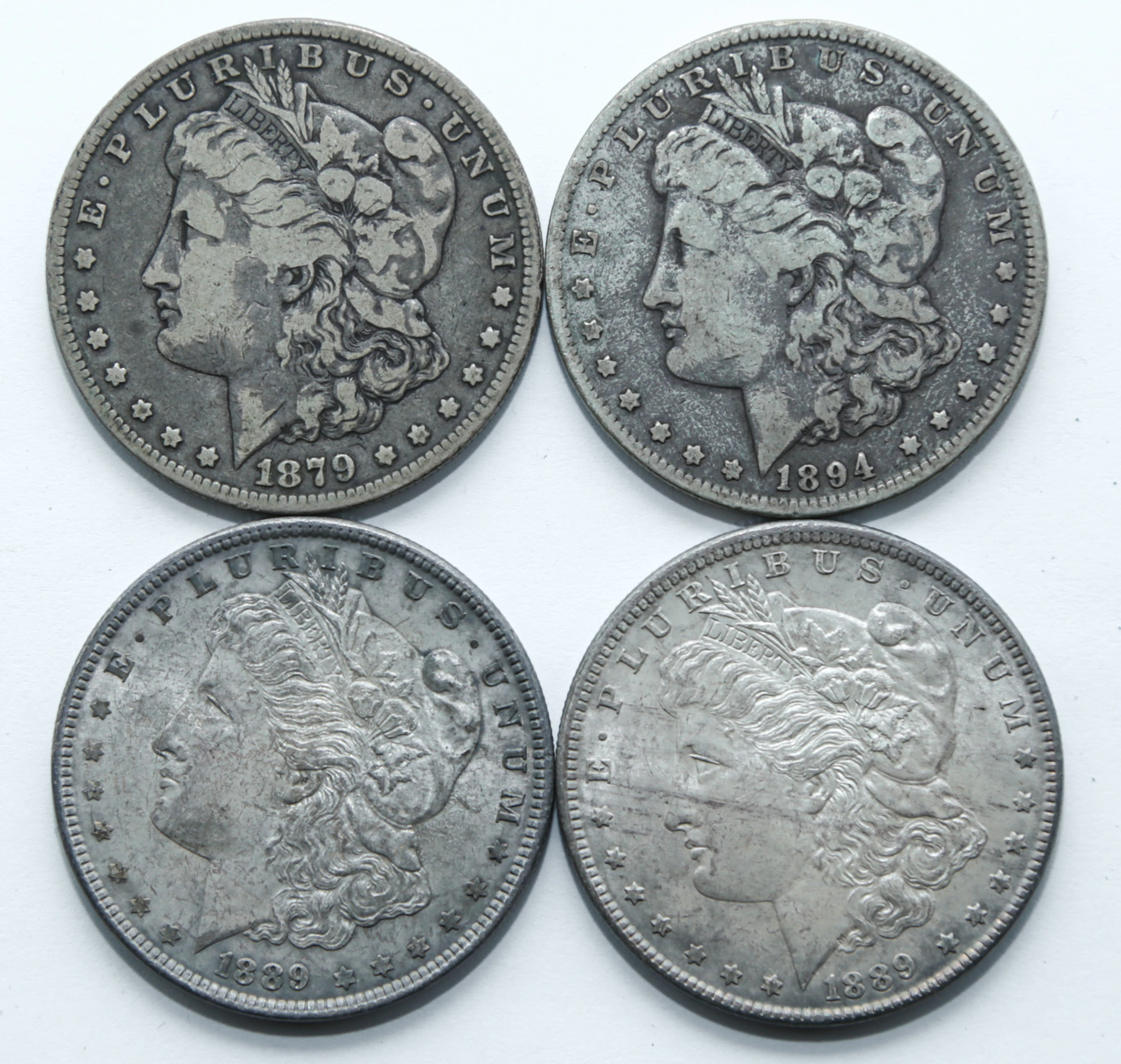 Four Morgan Dollars