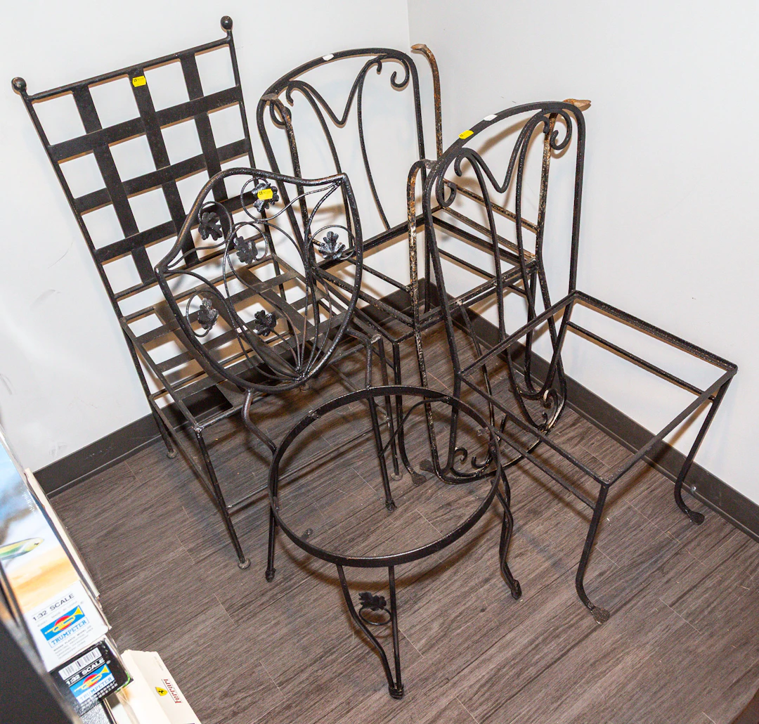 A Group of Iron Patio Chairs