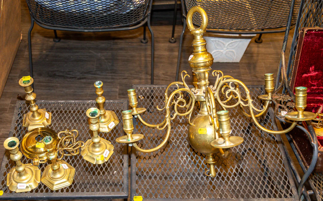 A Dutch Style Brass Chandelier & Five Candlesticks