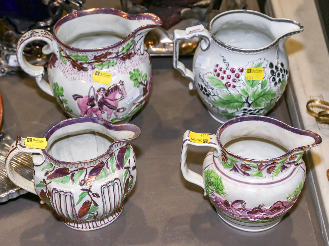 Four English Lustreware Milk Jugs