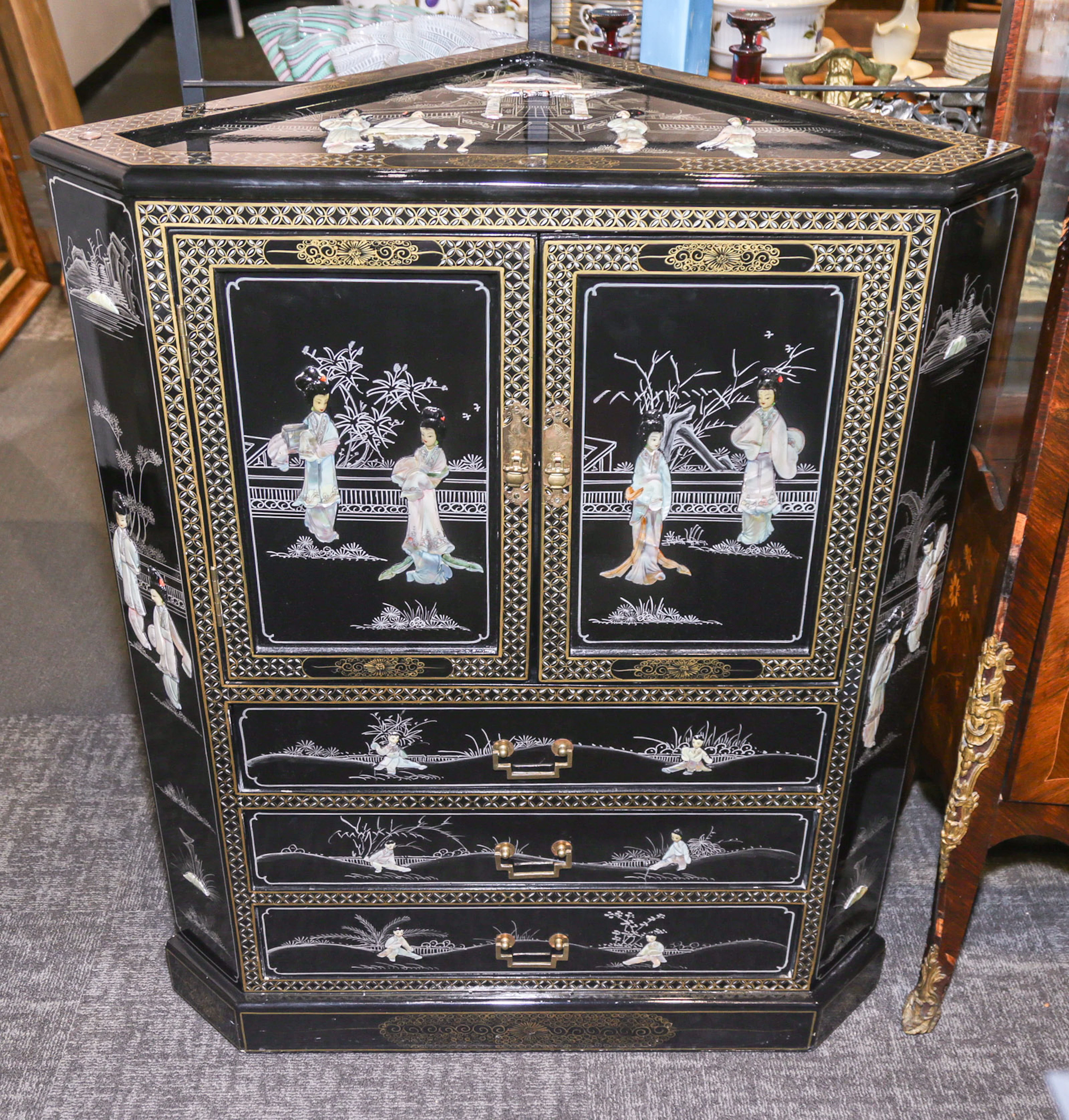 A Chinese Decorated Low Corner Cabinet