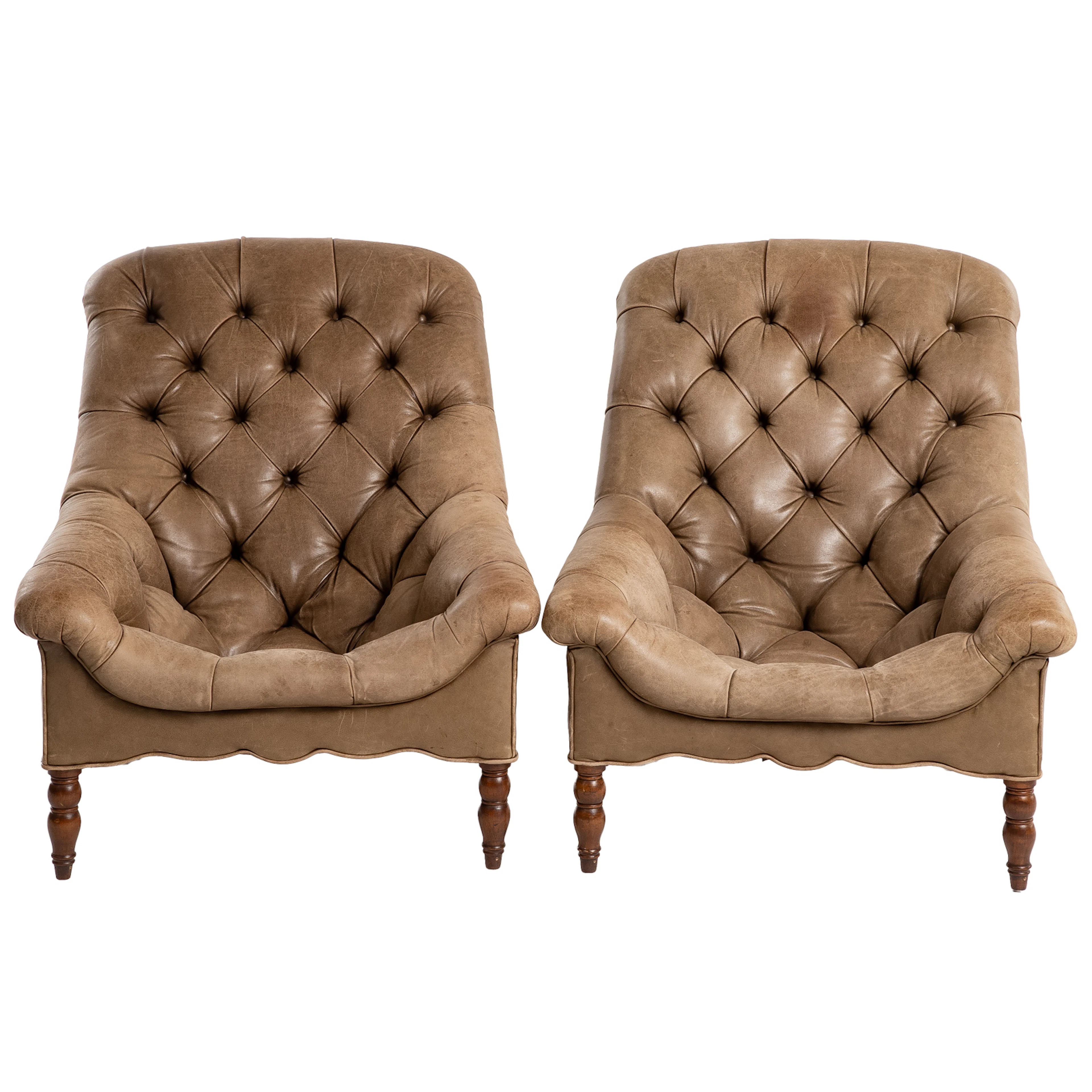 A Pair of R Jones Leather Tufted Chairs