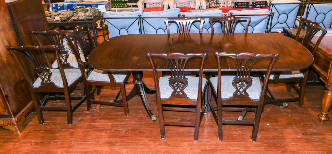A Regency Dining Table & Eight Chippendale Chairs