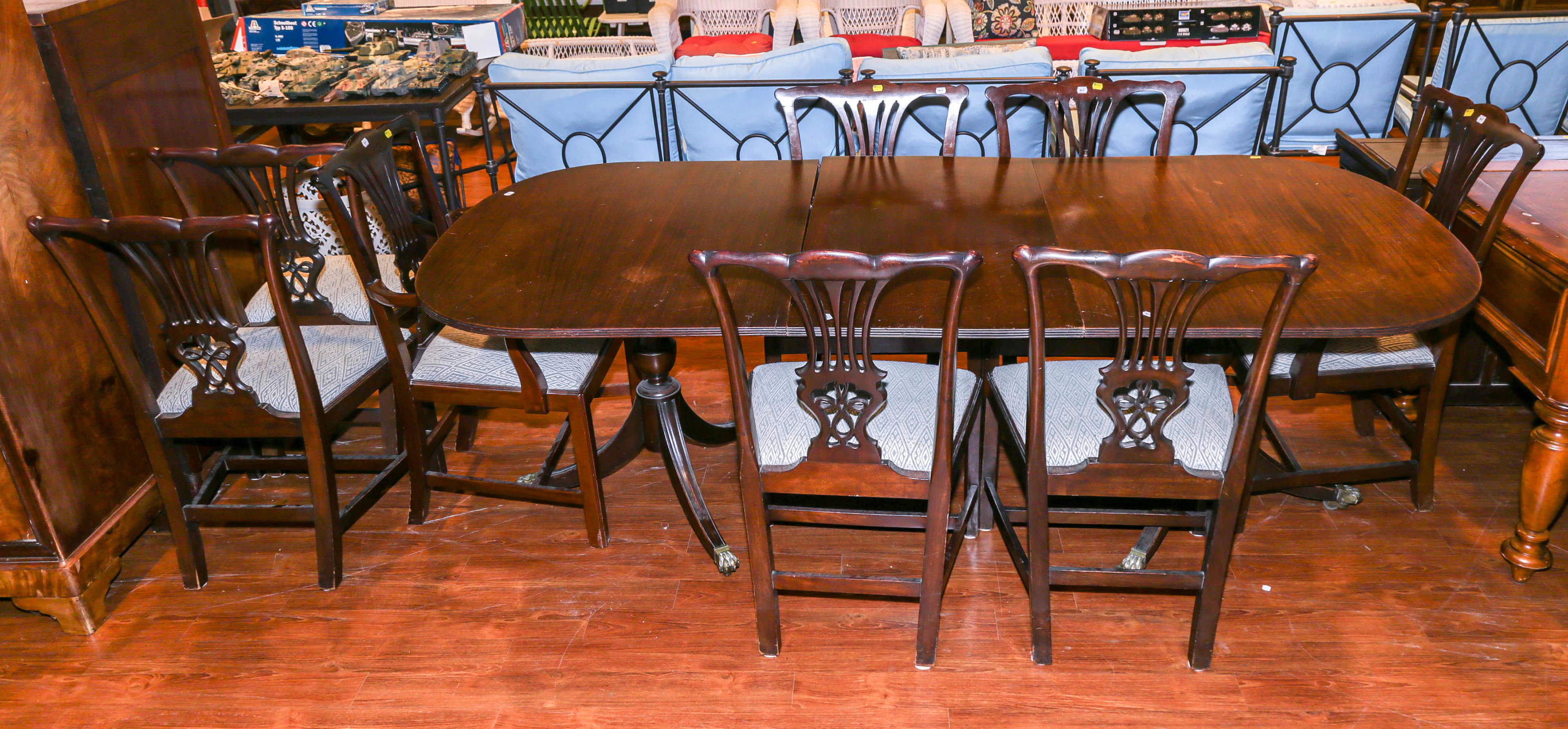 A Regency Dining Table & Eight Chippendale Chairs