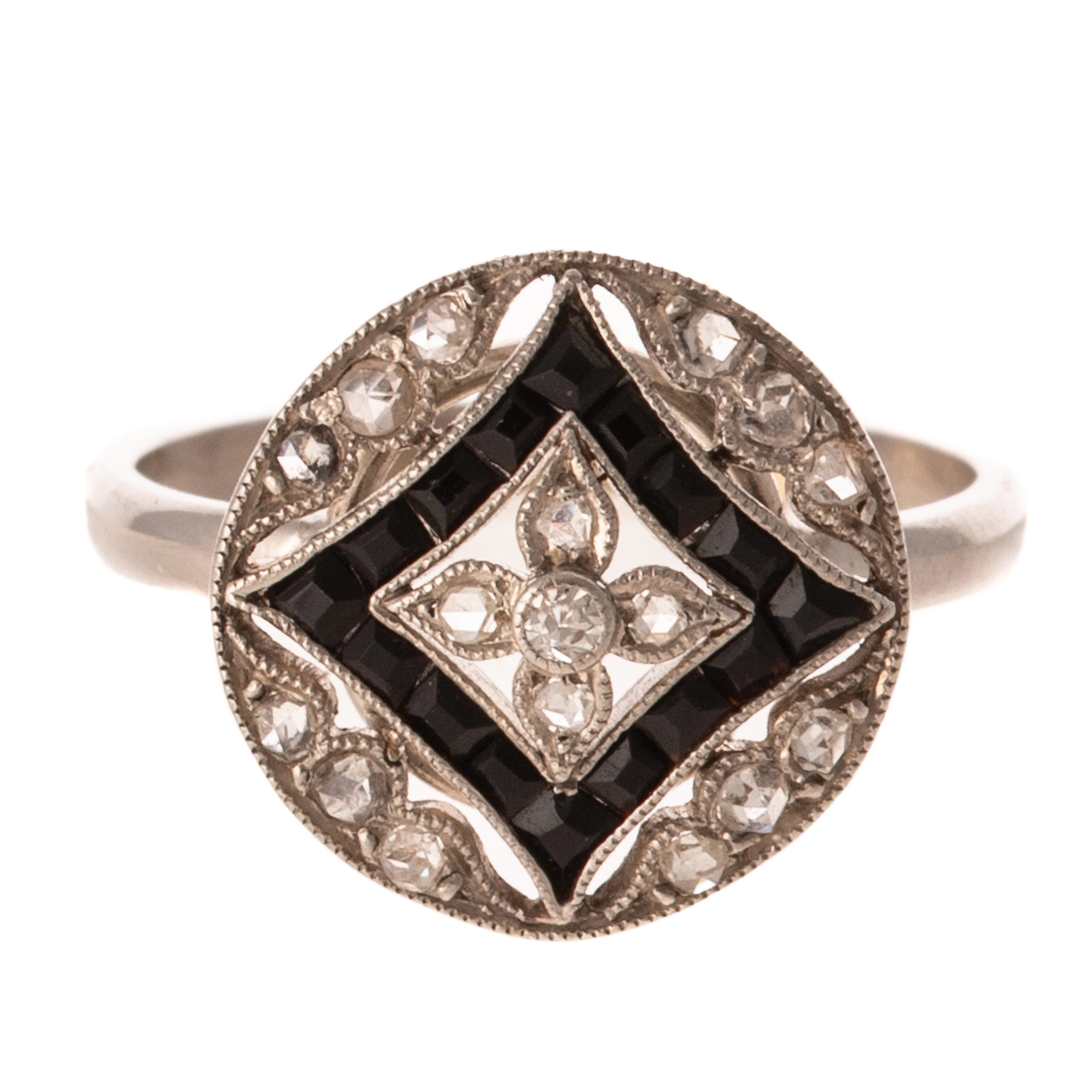 An Art Deco Diamond & Onyx Filigree Ring in Platinum