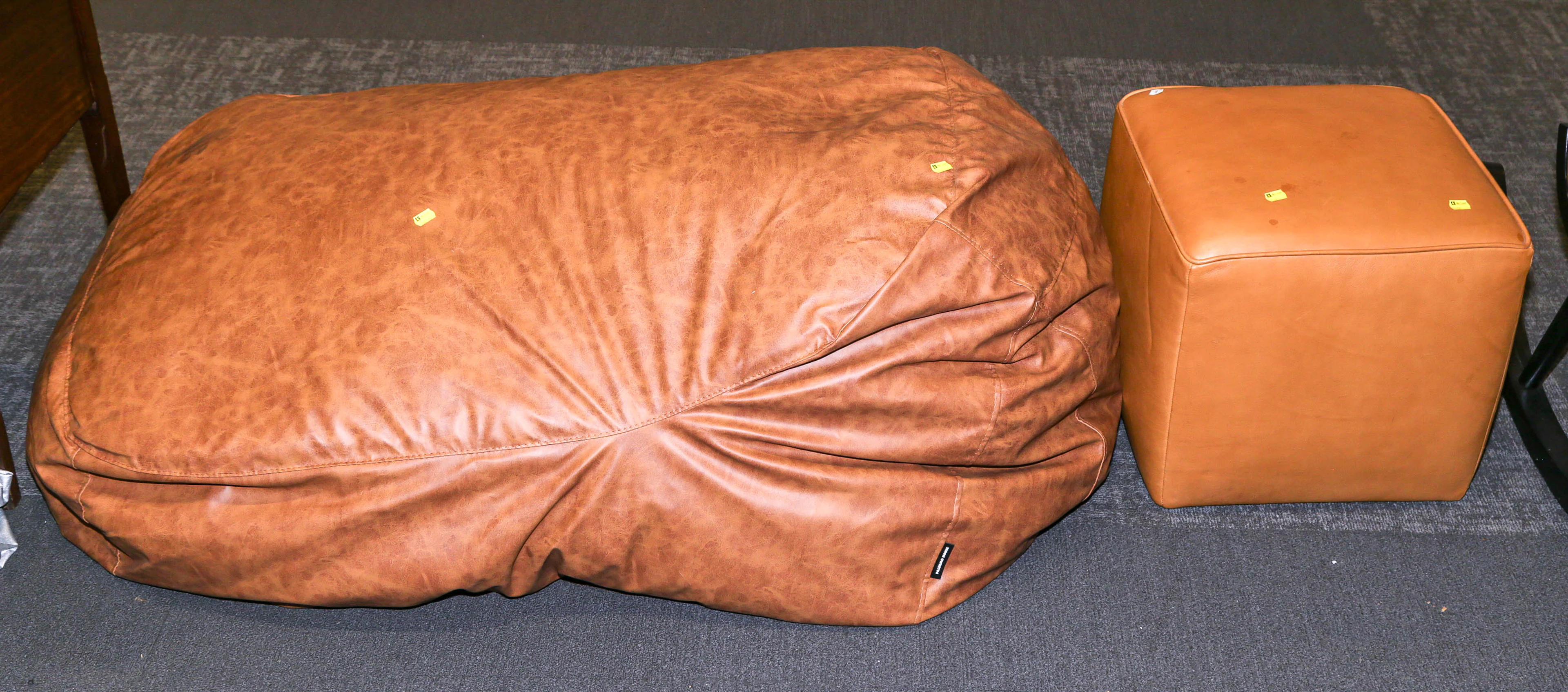 A Large Leather Sack Cushion & Leather Hassock