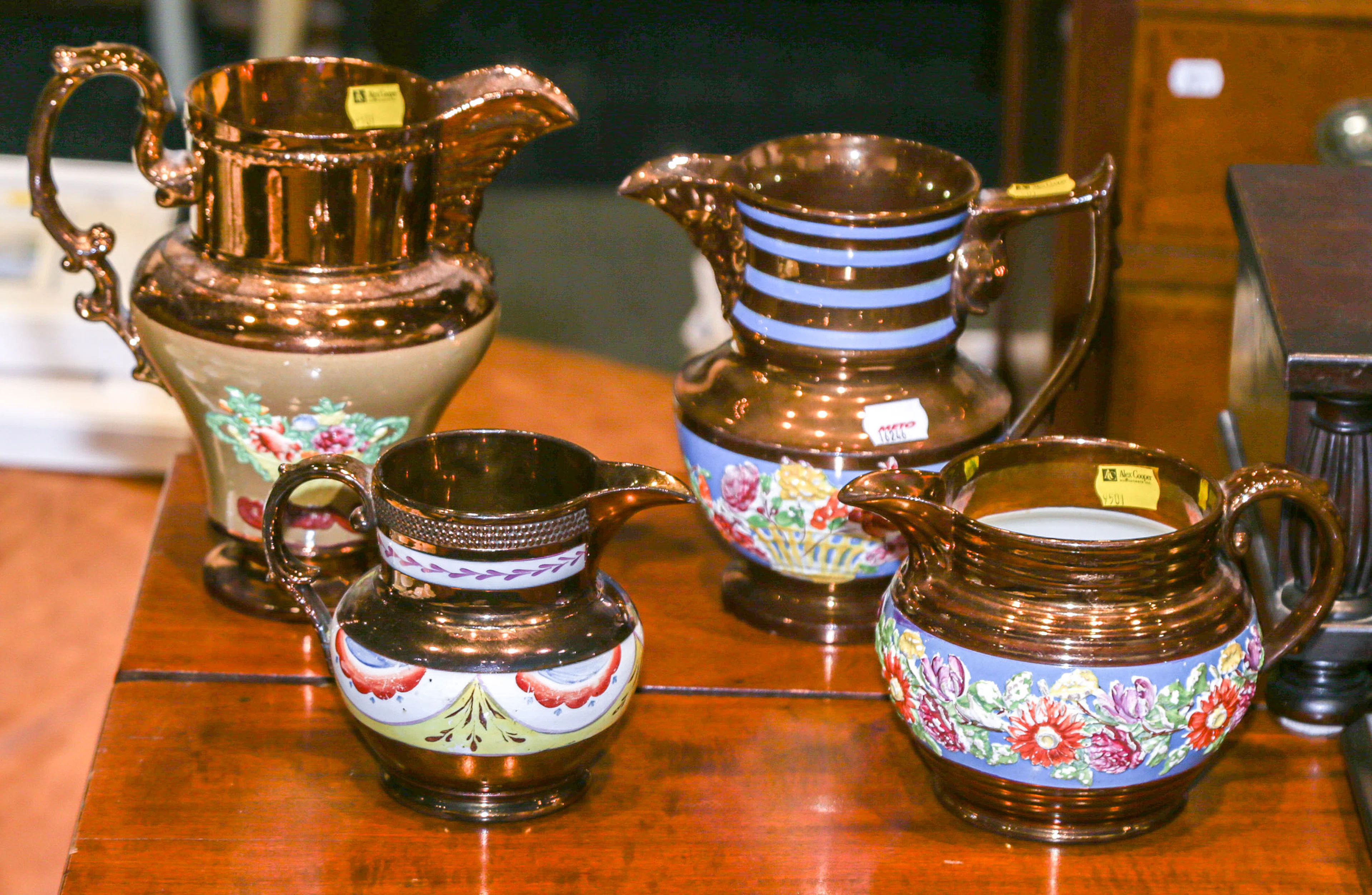 Four English Copper Lustre Jugs