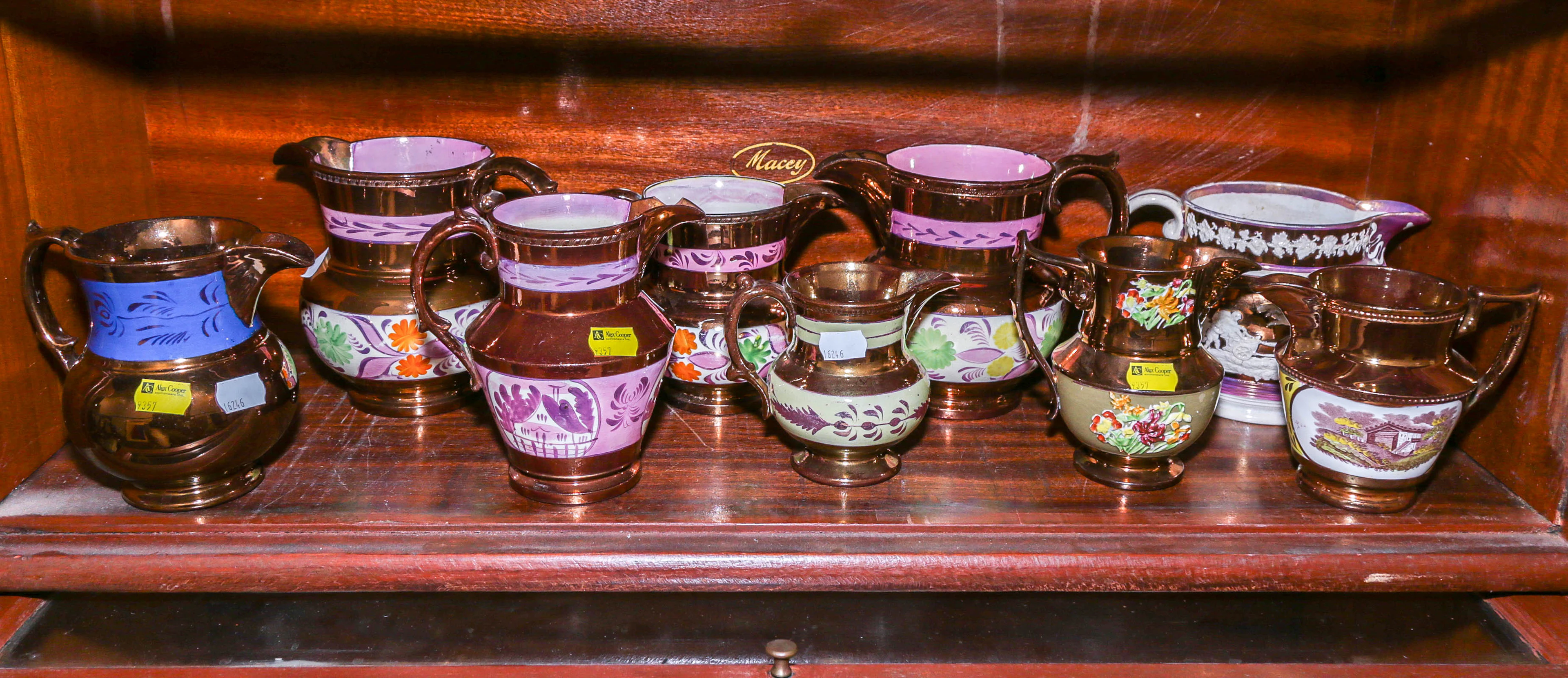 Nine English Copper Lustre Milk or Cream Jugs
