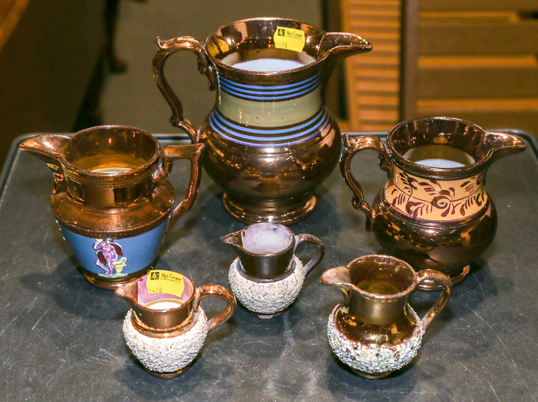 Six English Copper Lustre Cream Jugs