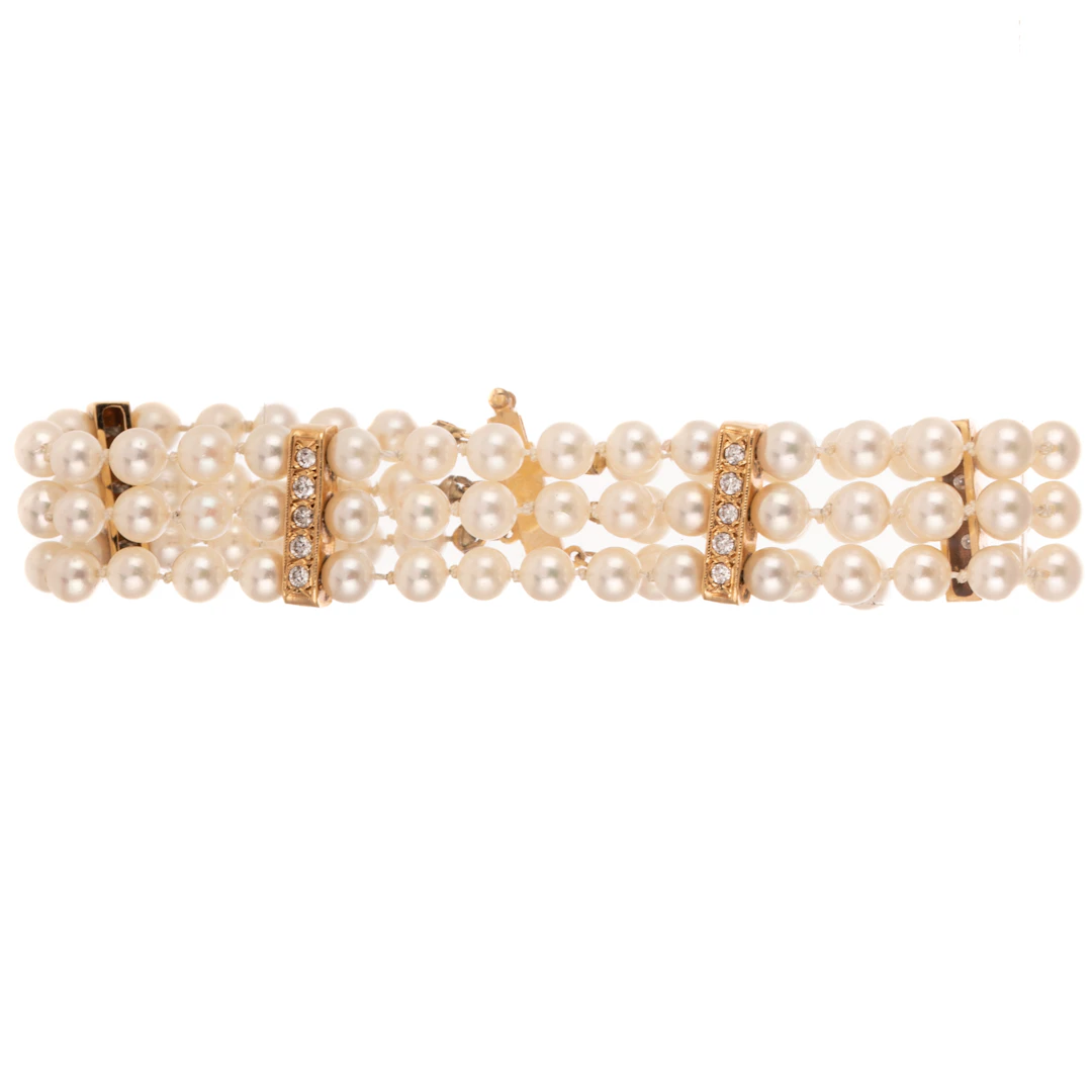 A Triple Strand Pearl & Diamond Bracelet in 14K