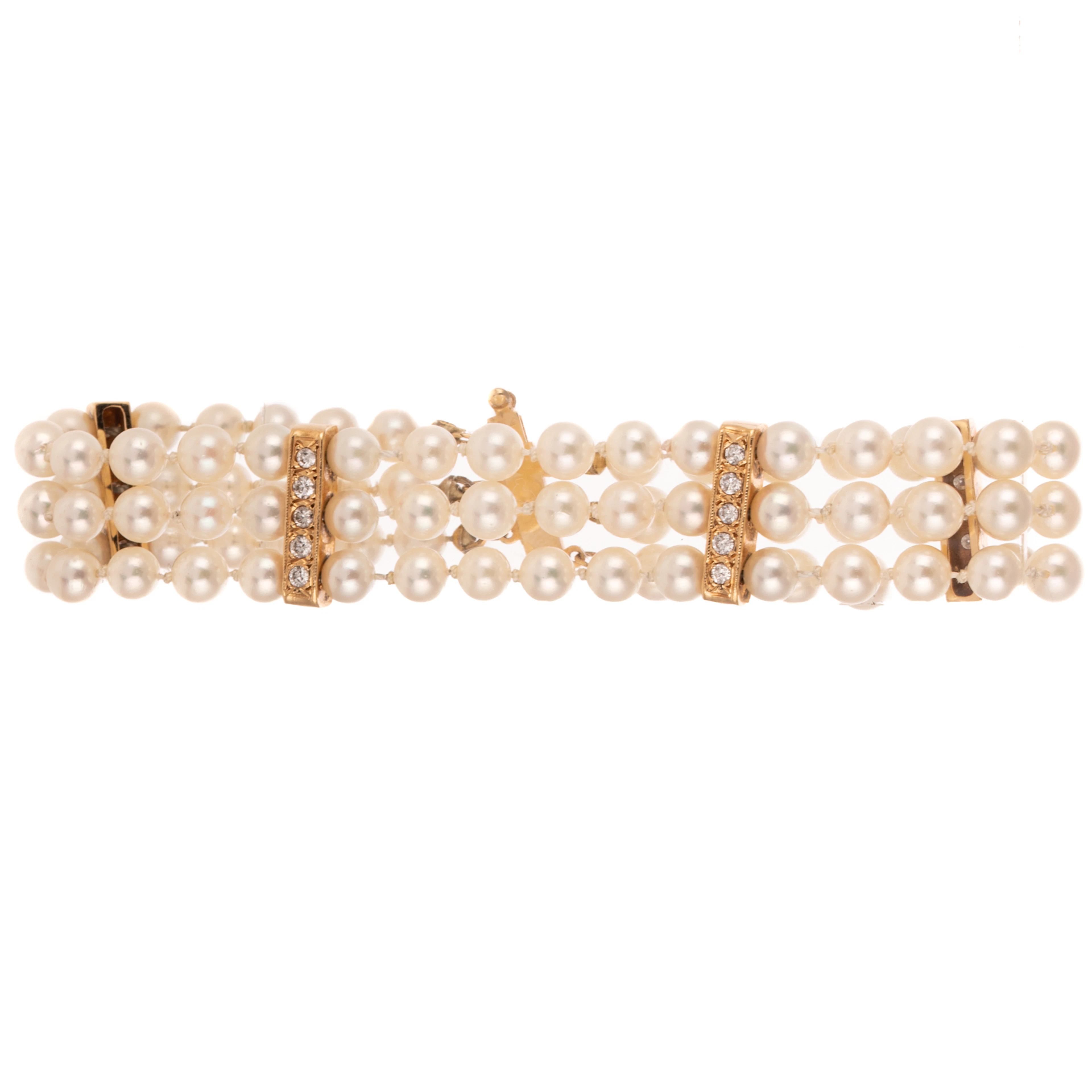 A Triple Strand Pearl & Diamond Bracelet in 14K