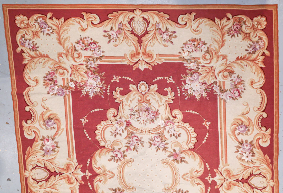 An Aubusson Pattern Needlepoint Rug, 8.11 x 13.11