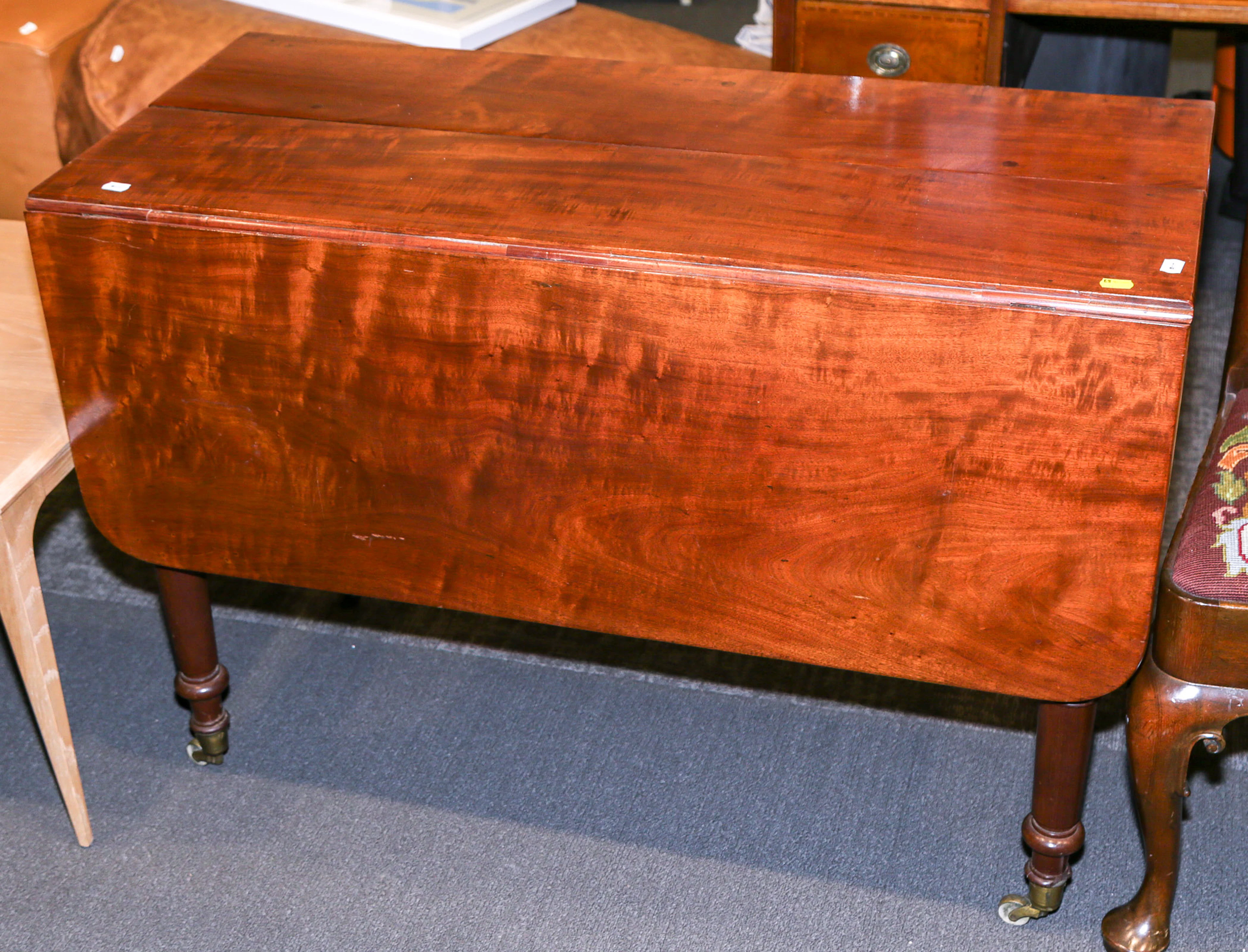 An Early Victorian Mahogany Dining Table