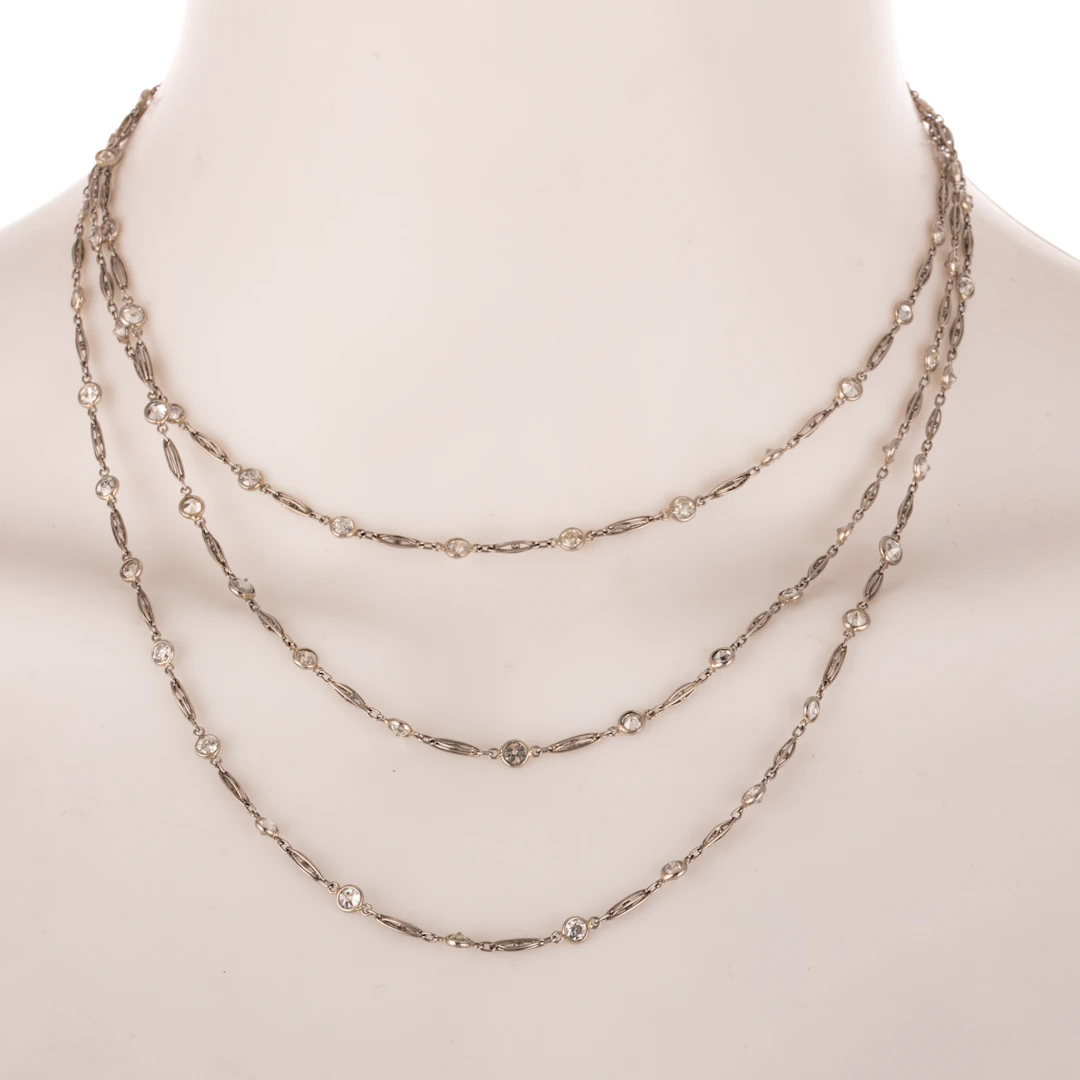 An Art Deco 12.50 ctw Diamond Station Necklace in Platinum