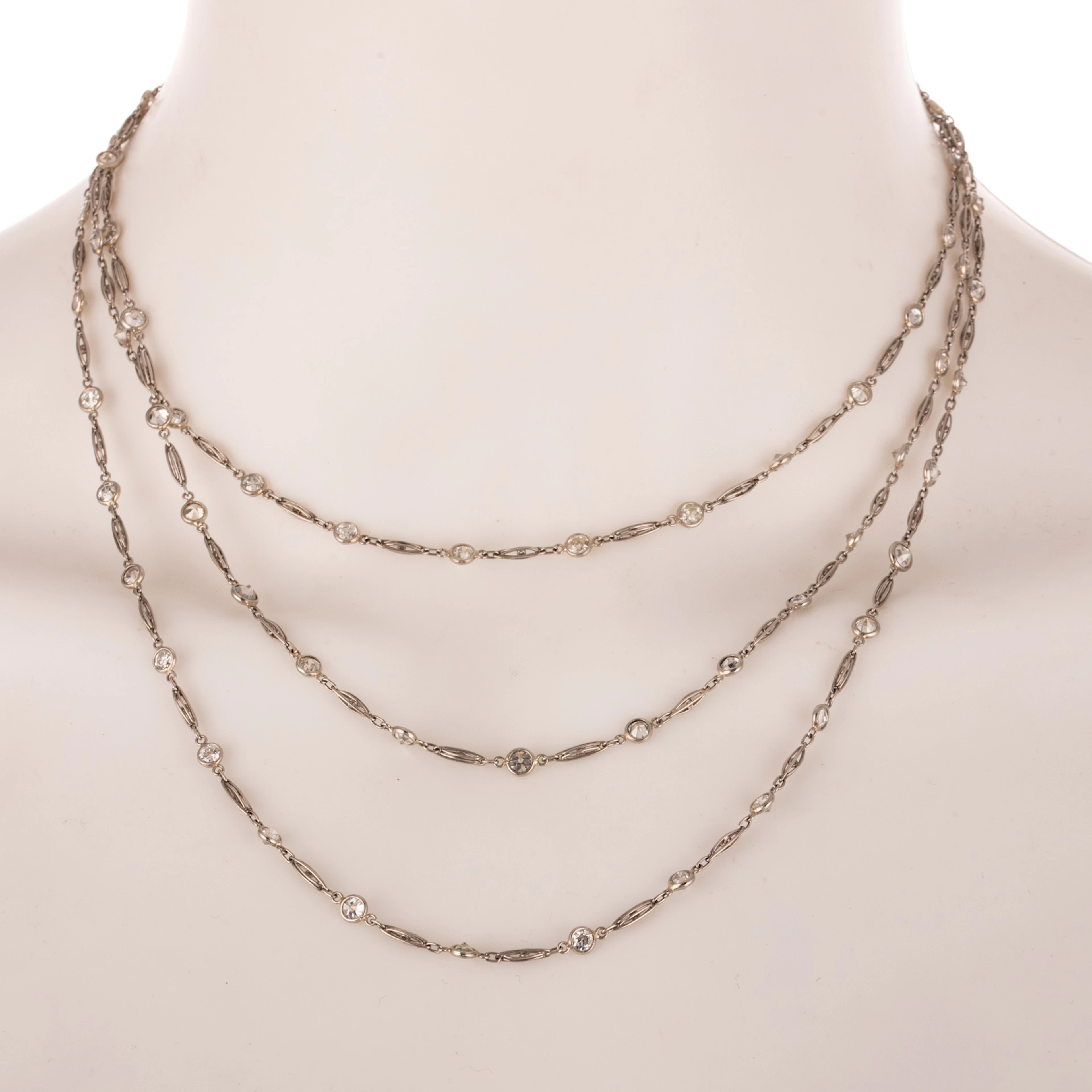 An Art Deco 12.50 ctw Diamond Station Necklace in Platinum