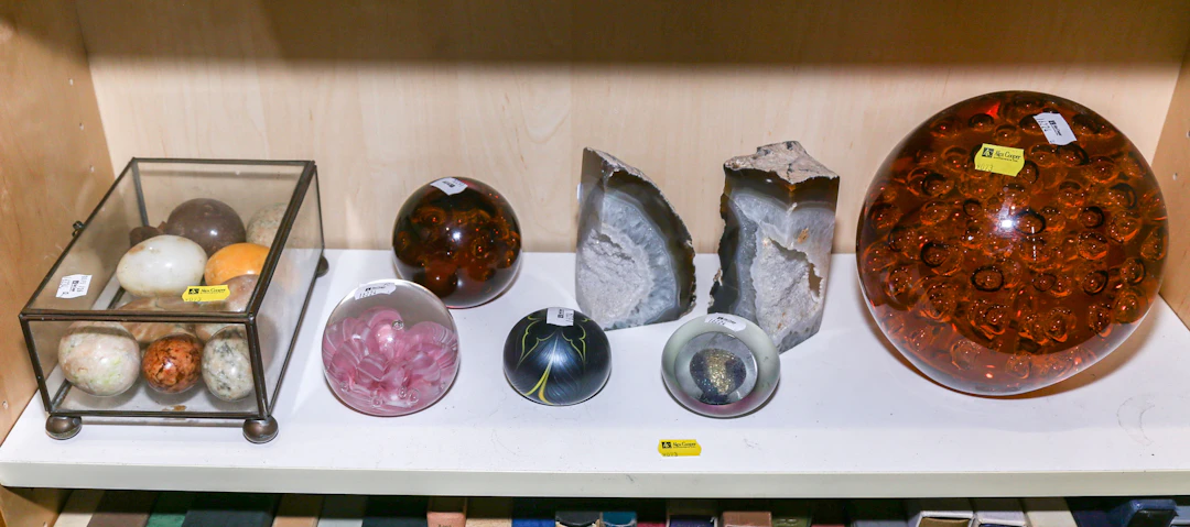 A Selection of Glass Paperweights & Stone Eggs
