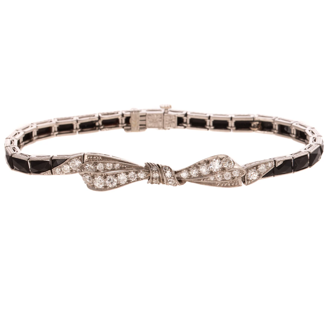 An Art Deco Diamond & Onyx Bow Bracelet in Platinum