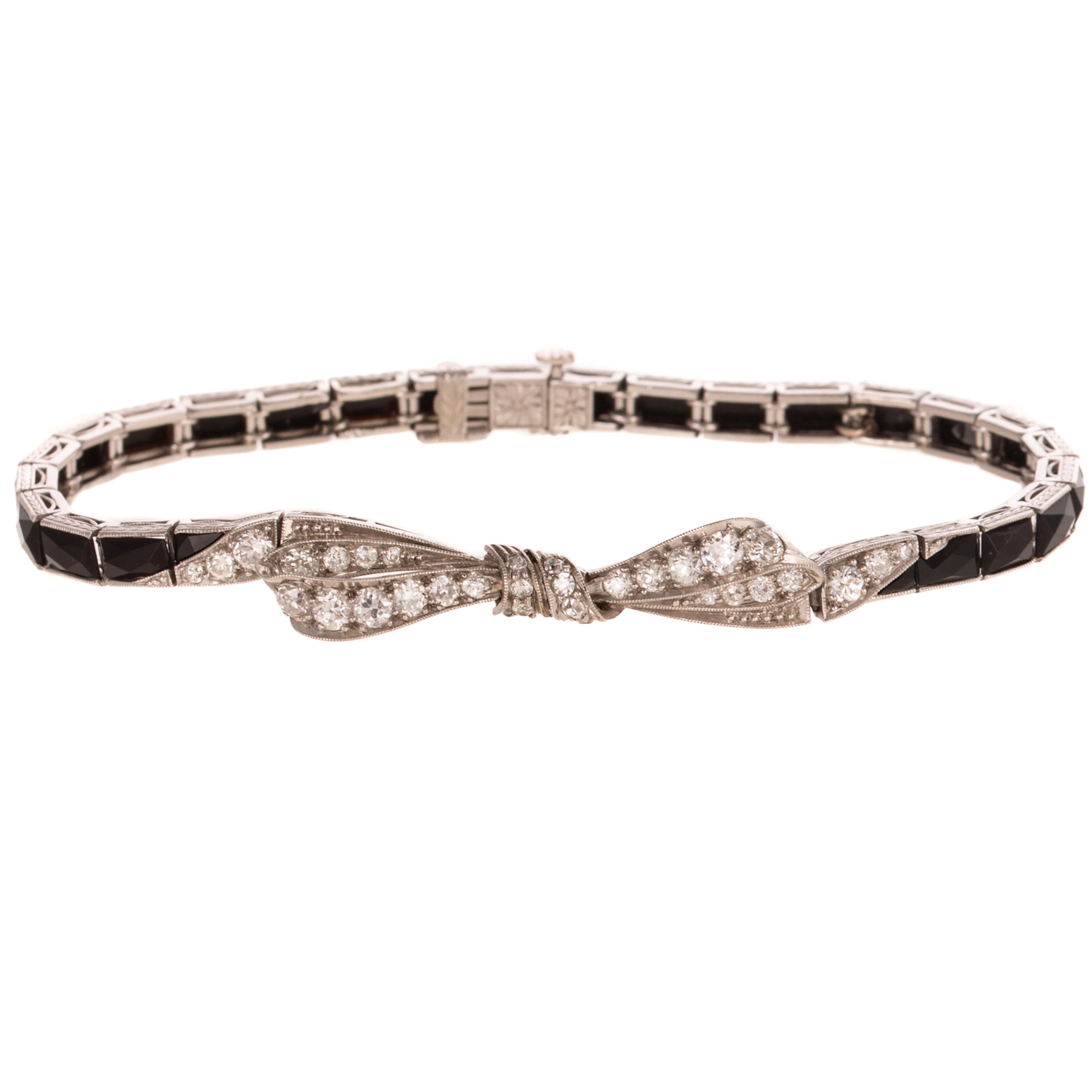 An Art Deco Diamond & Onyx Bow Bracelet in Platinum