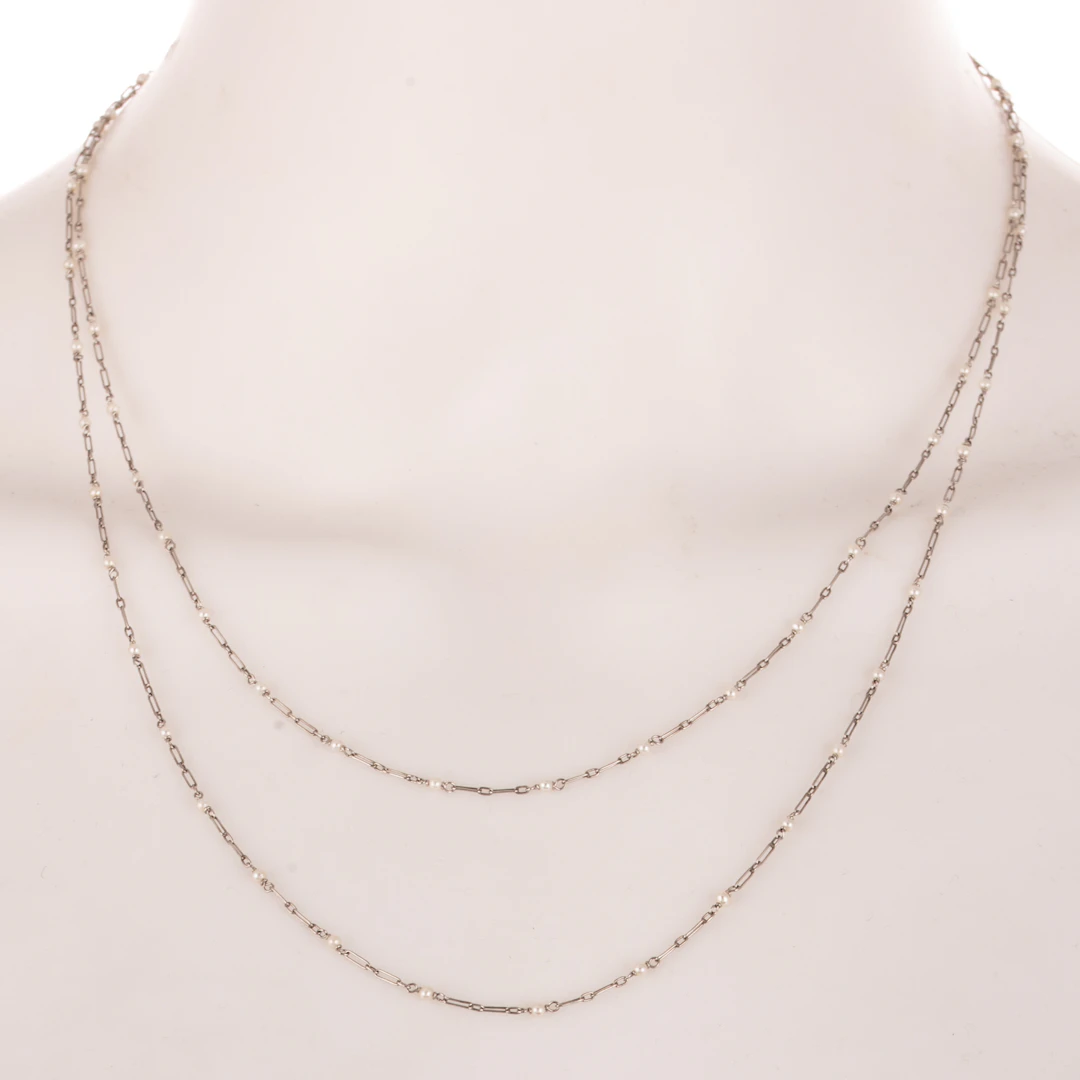 An Antique Pearl Station Necklace in Platinum