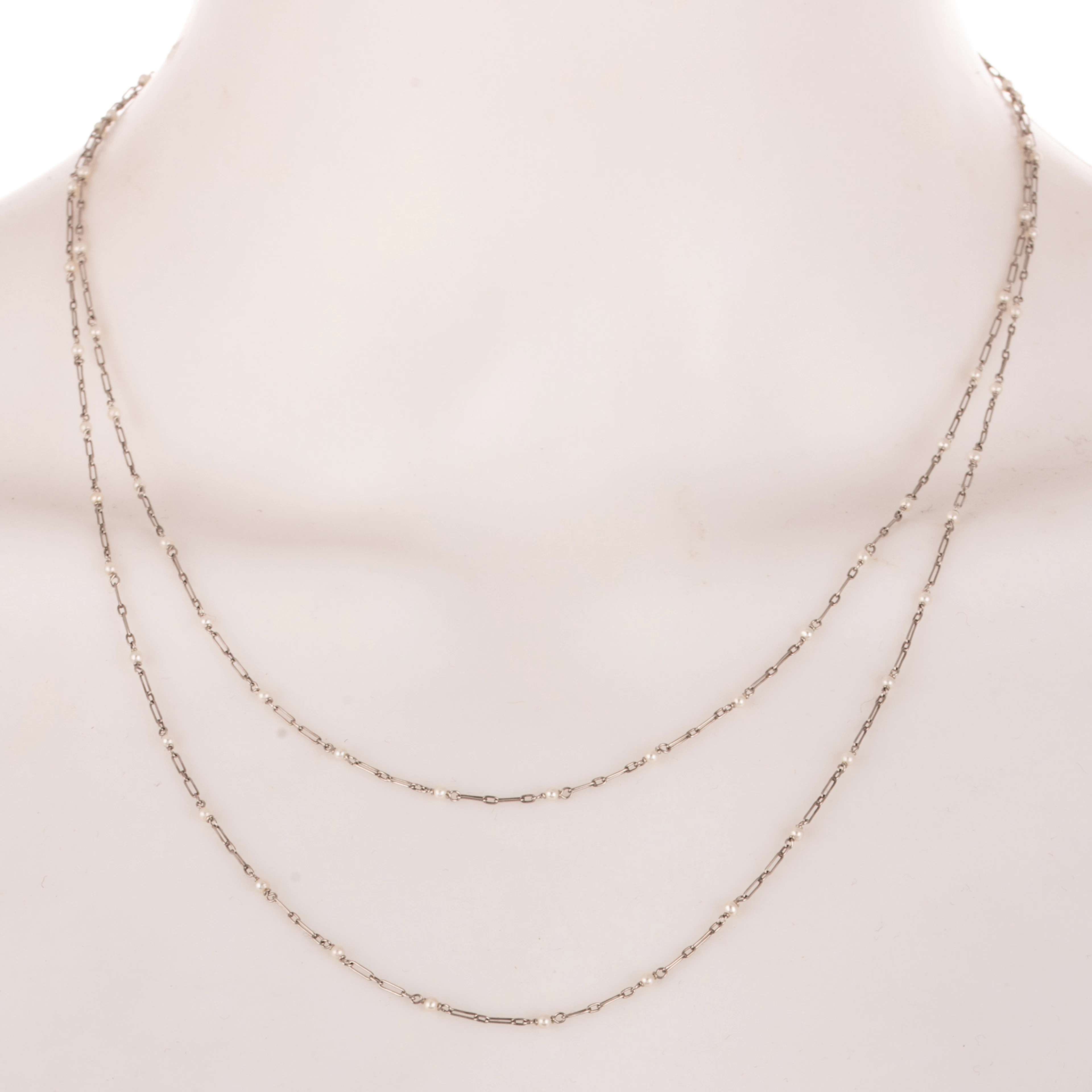 An Antique Pearl Station Necklace in Platinum