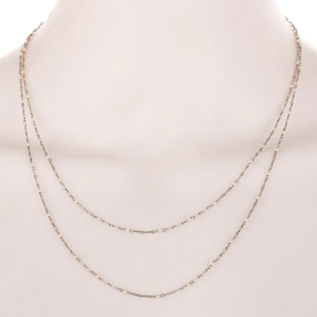 An Antique Pearl Station Necklace in Platinum
