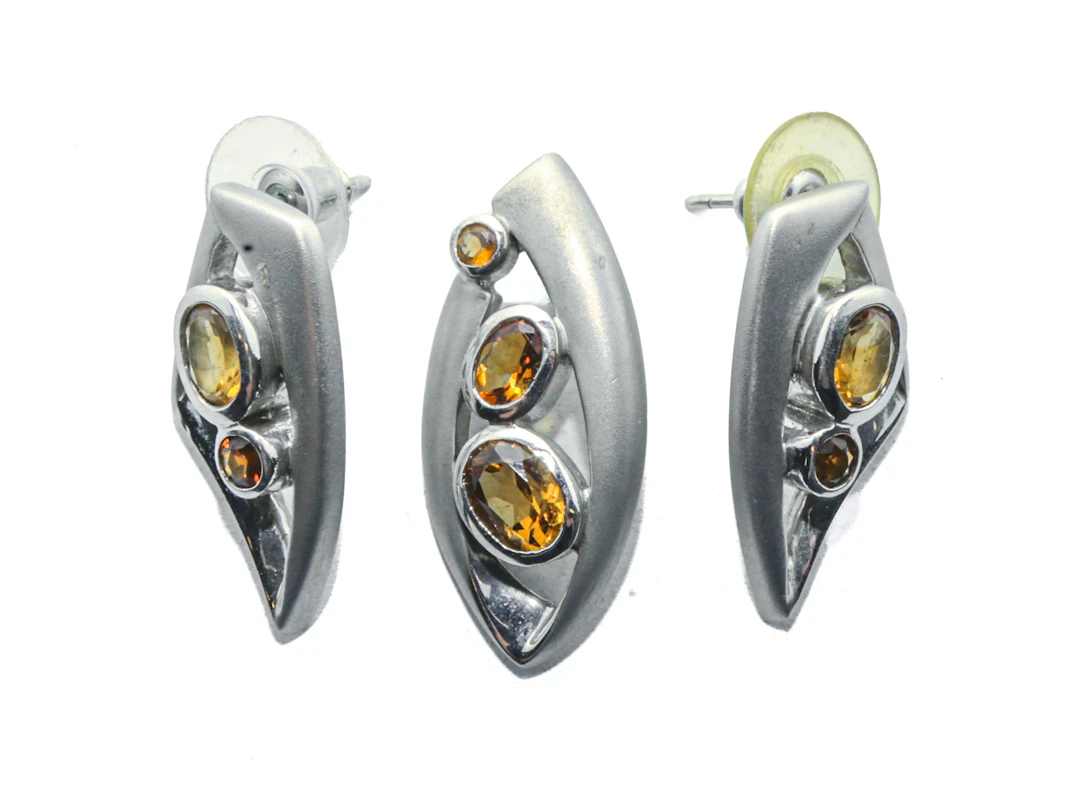 A Sterling Silver Topaz Earring & Pendant Set