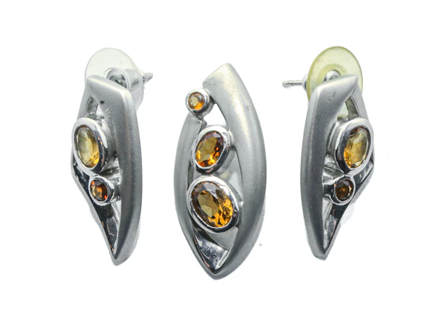 A Sterling Silver Topaz Earring & Pendant Set