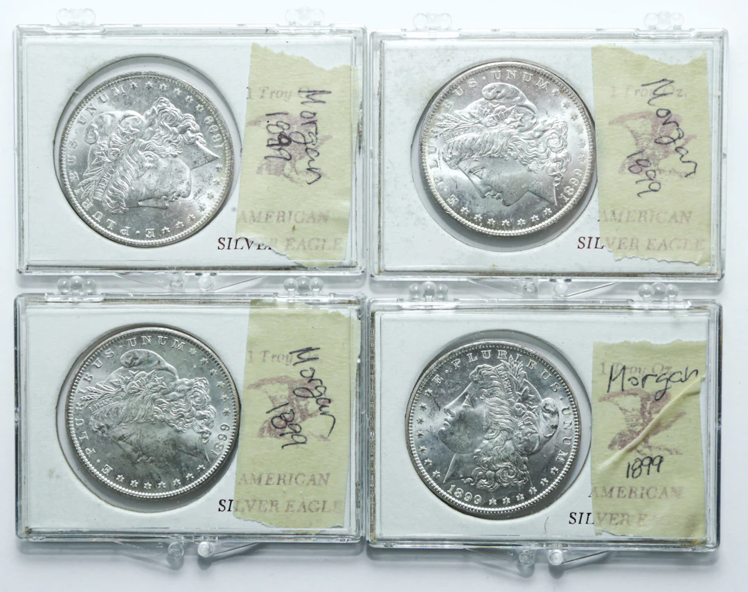 Four 1899-O BU Silver Dollars