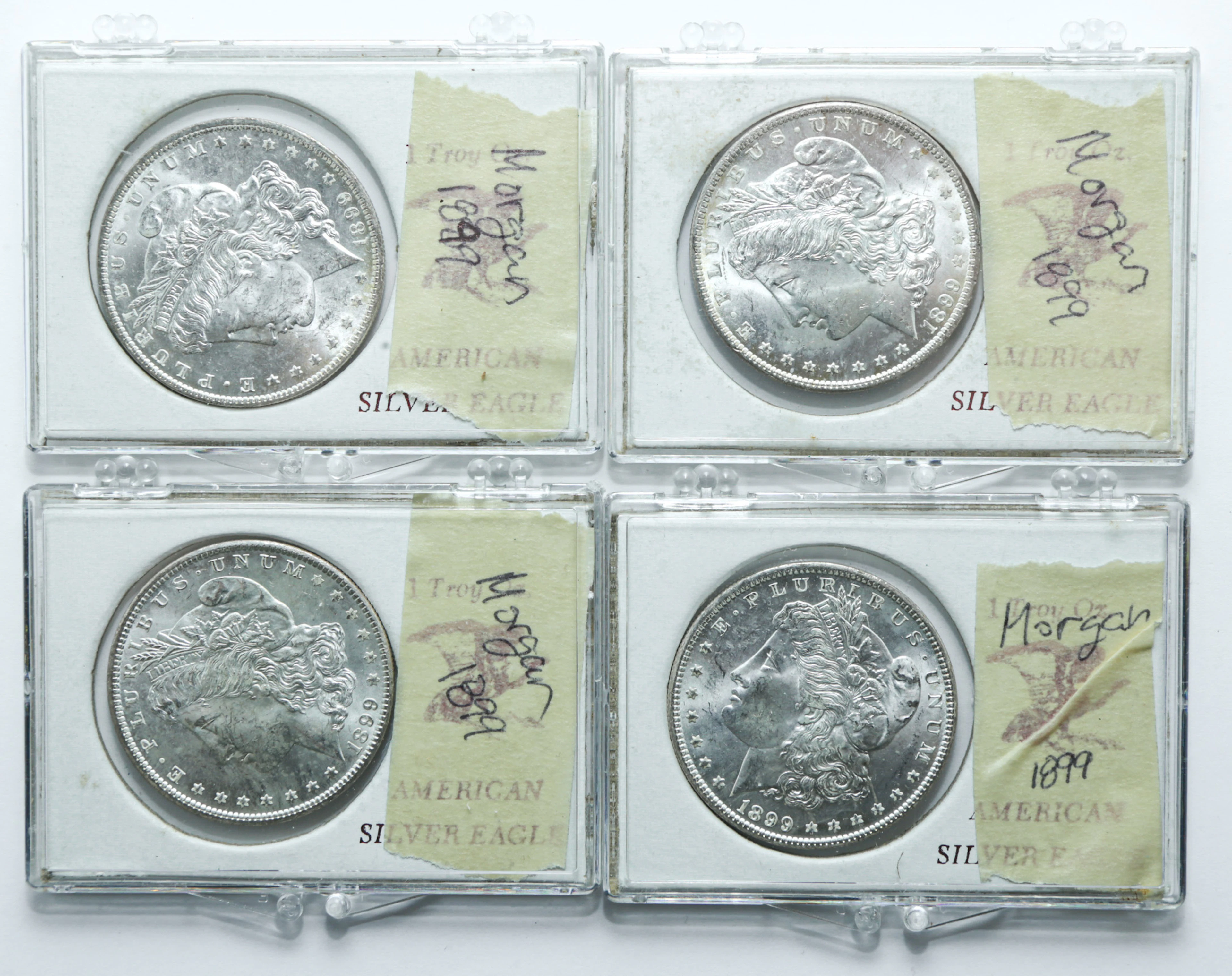 Four 1899-O BU Silver Dollars