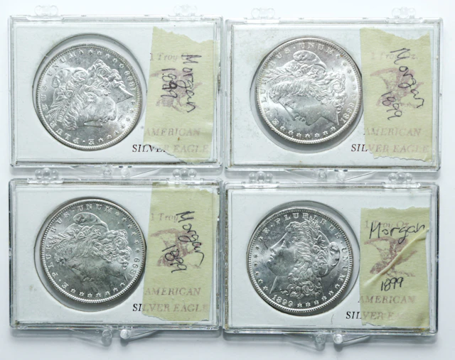 Four 1899-O BU Silver Dollars