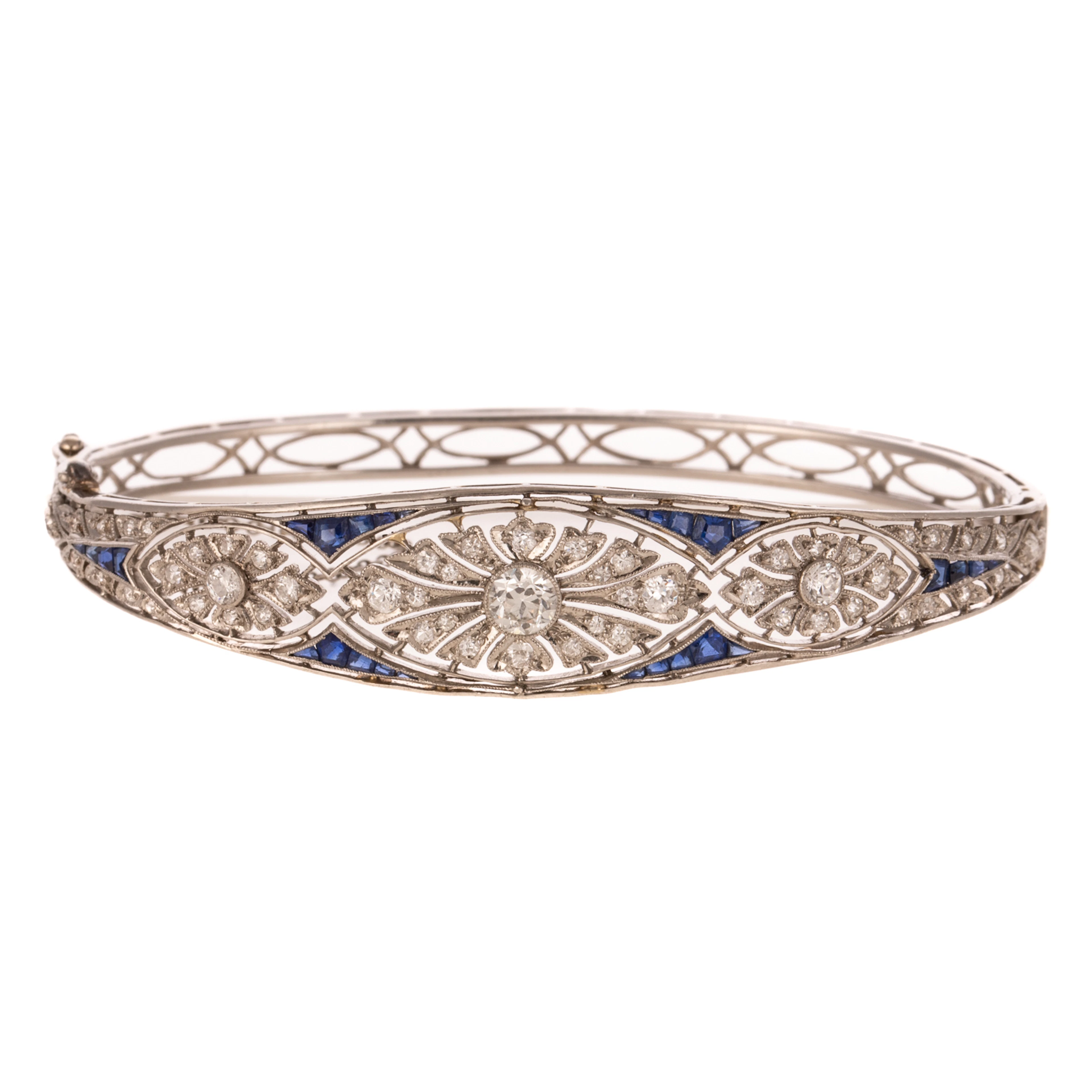 An Art Deco Diamond & Sapphire Bangle Bracelet in Platinum