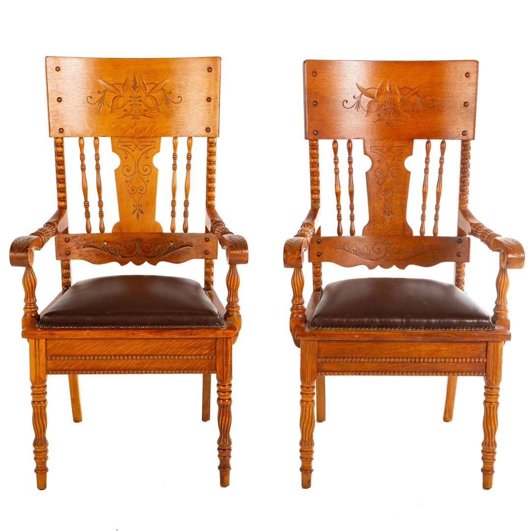 A Pair of Victorian Carved & Incised Oak Armchairs