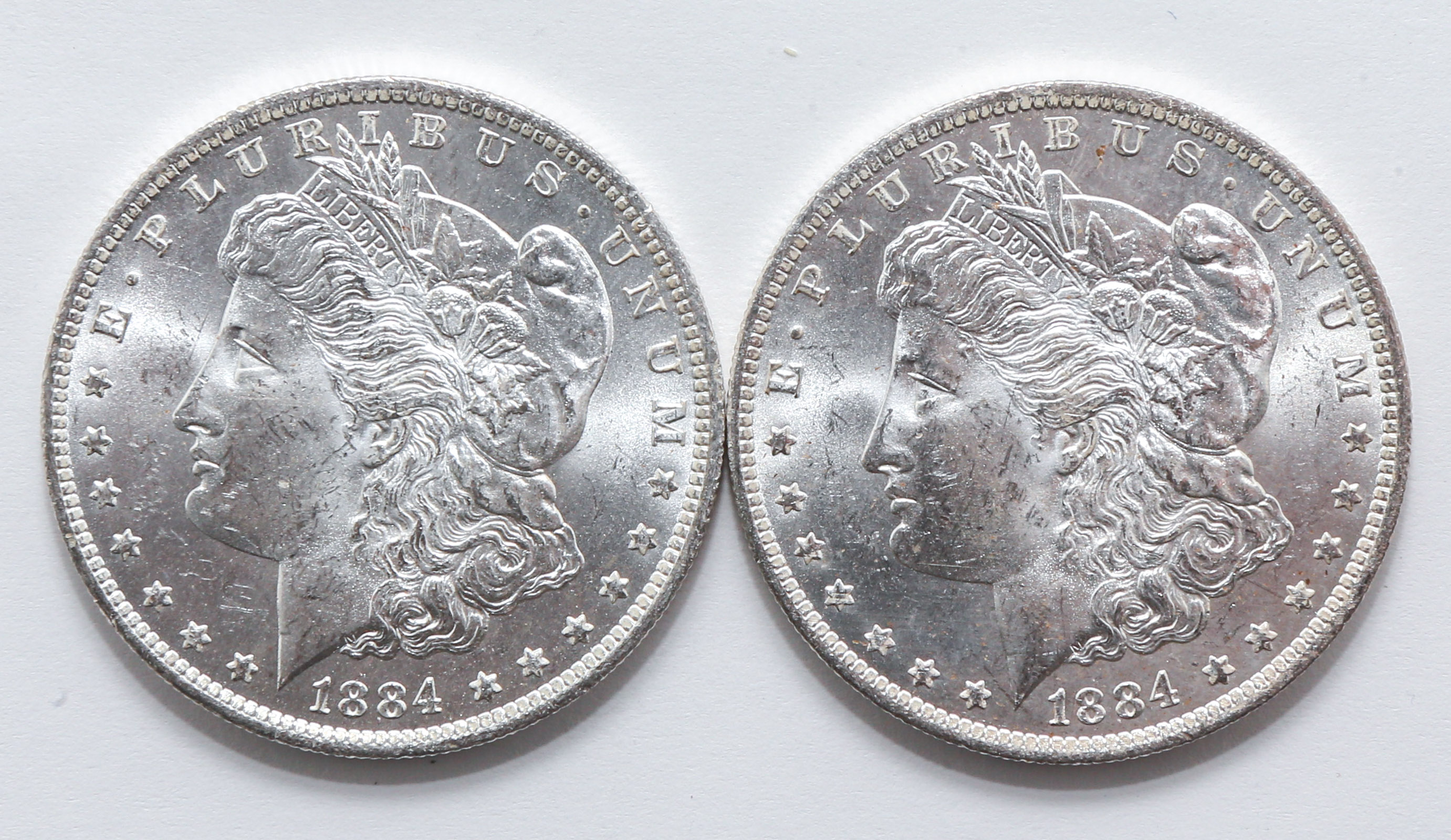 Two MS-63 1884-O Morgan Dollars