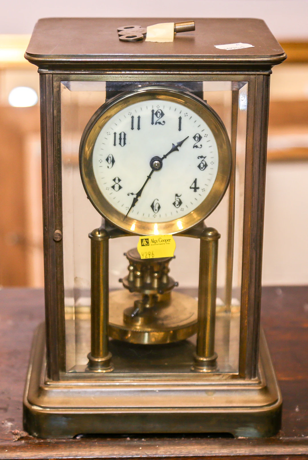 An Anniversary Clock in Brass & Glass Case