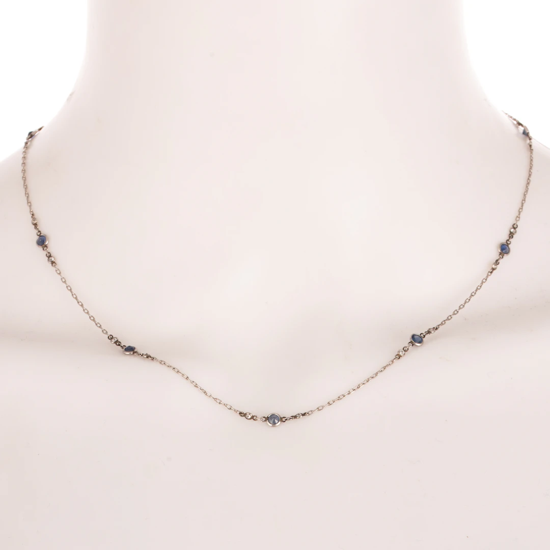 An Art Deco Sapphire & Diamond Station Necklace in Platinum