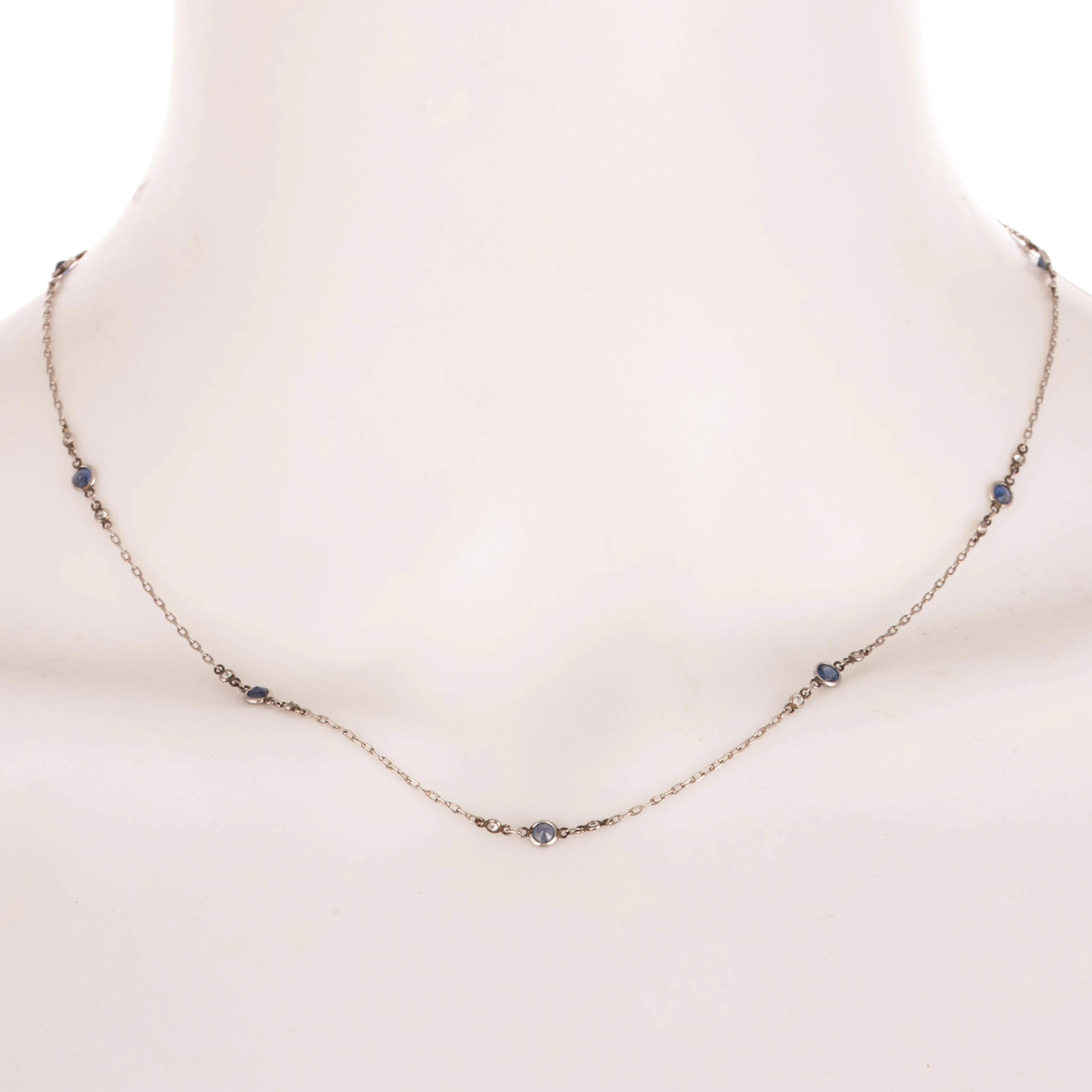 An Art Deco Sapphire & Diamond Station Necklace in Platinum