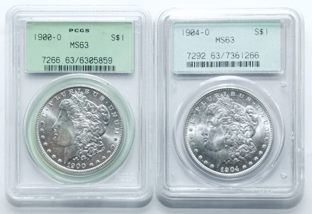 Two PCGS MS63 Morgan Dollars - Older Holders