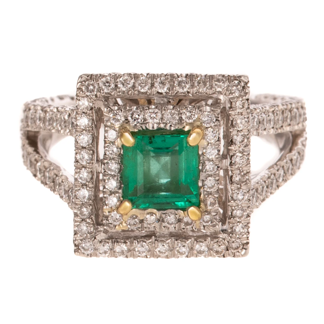 A Double Halo Emerald & Diamond Ring in Platinum
