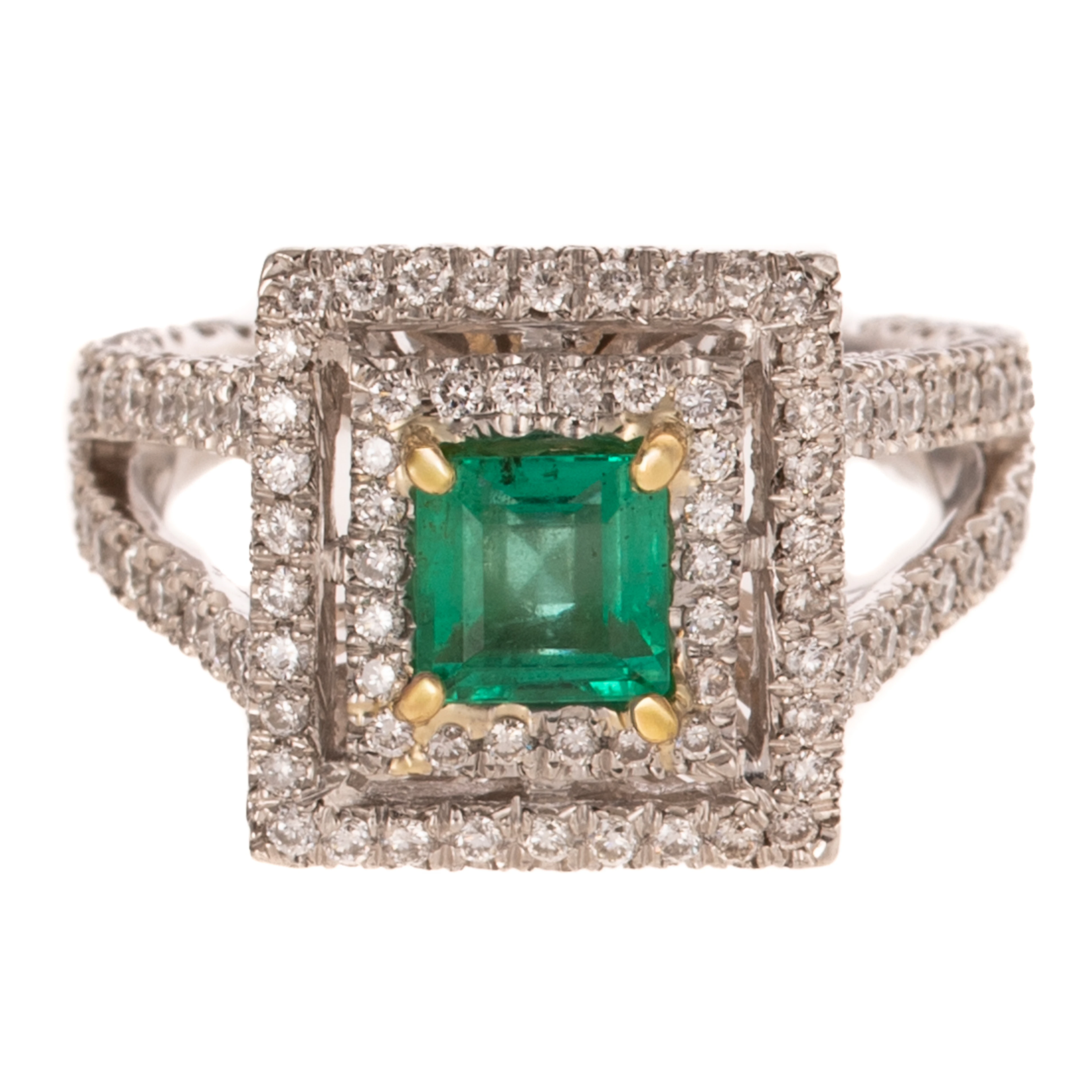 A Double Halo Emerald & Diamond Ring in Platinum