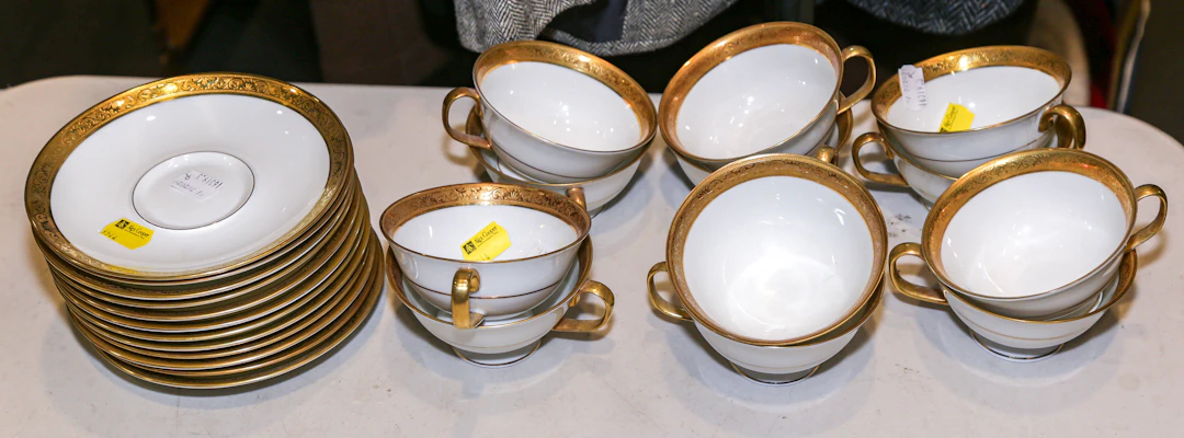 A Group of Raynaud Limoges Gilt Cups & Saucers