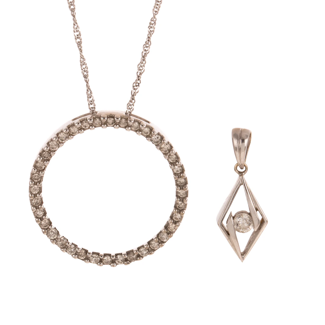 Two Pendants Hanging on Chains in Gold
